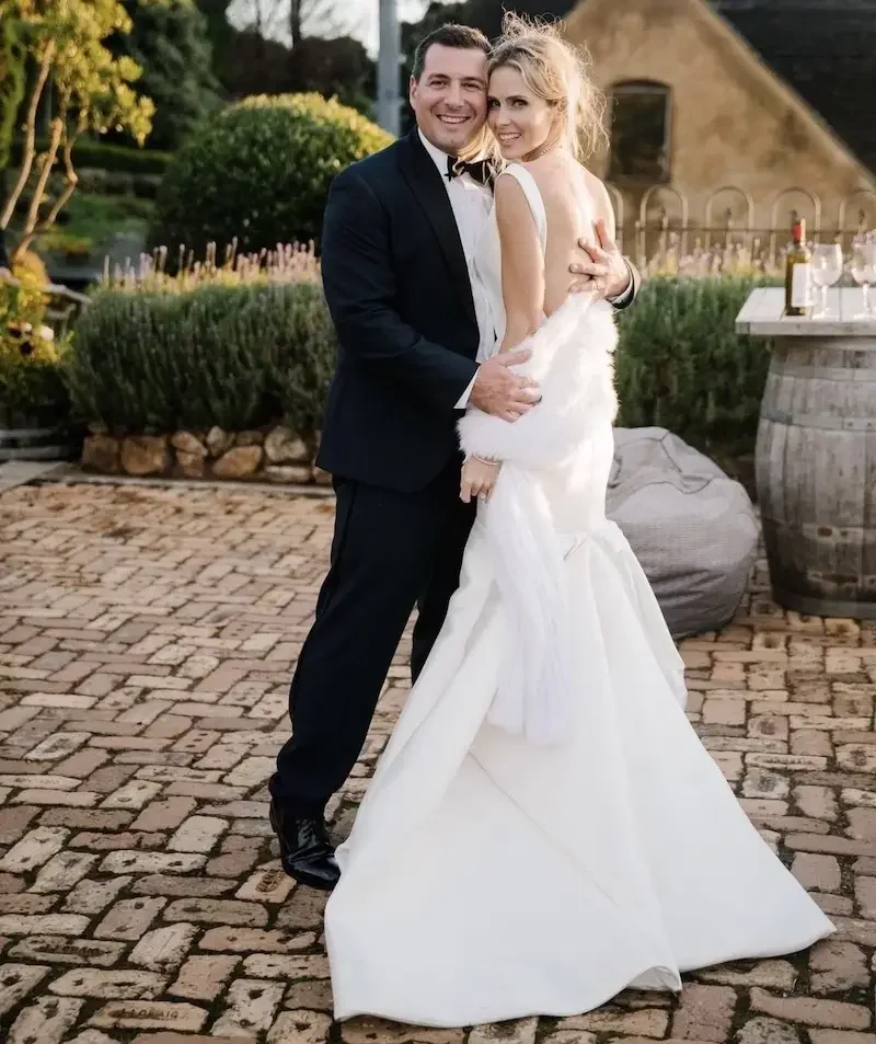 Anna and Mike celebrating at their Mudbrick Vineyard wedding on Waiheke Island