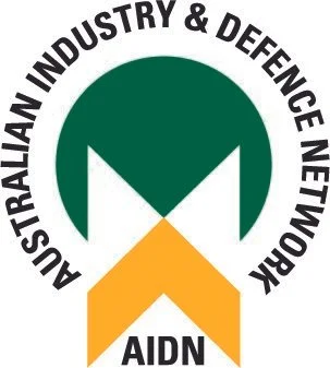 Logo of the Australian Industry & Defence Network (AIDN) featuring a stylized green and yellow emblem with the organization's name encircling it.