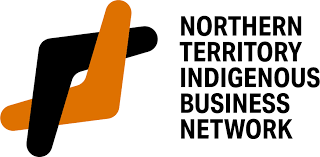 Logo of Northern Territory Indigenous Business Network with stylized black and orange abstract shape and bold black text.