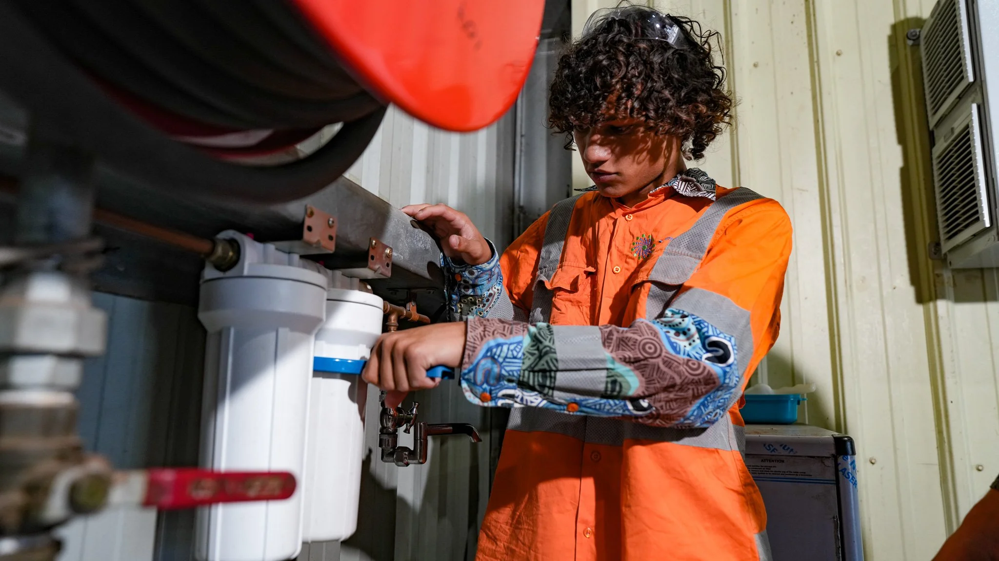 Industrial electrician inspecting electrical equipment