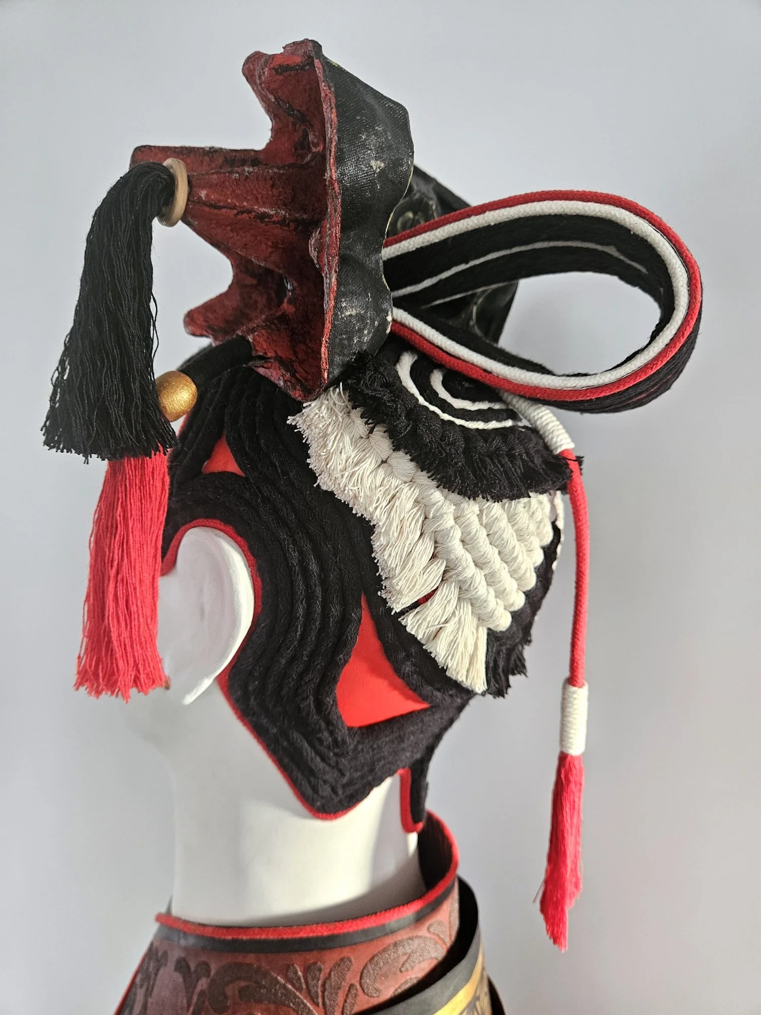 Details of the headpiece on a sculptural piece, the view is from the back.