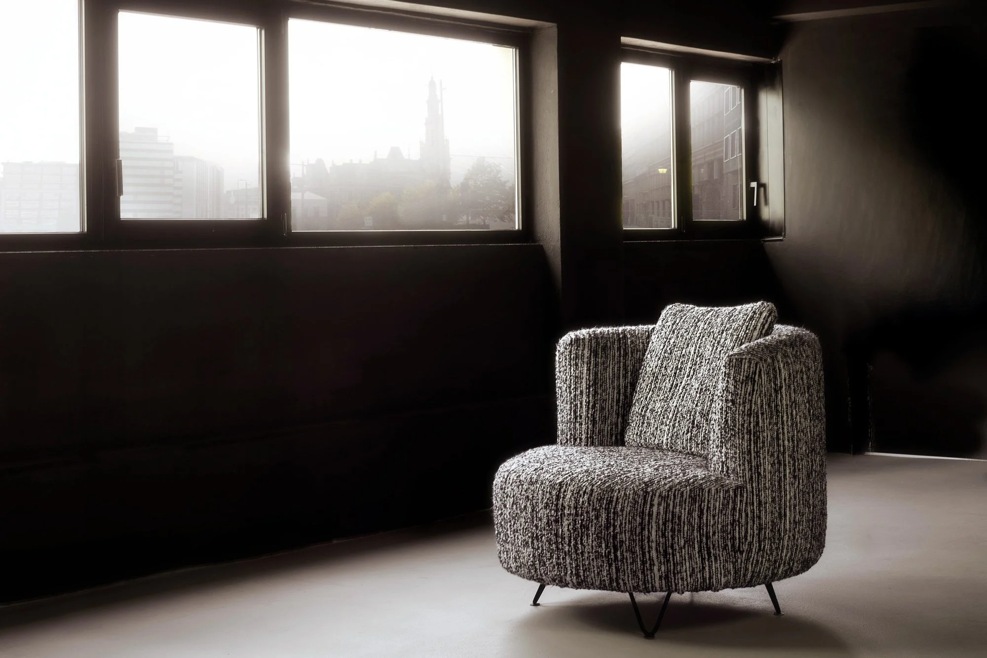 A study on light and shadow. This luxury armchair is captured in a moody, atmospheric setting, highlighting the exquisite materials and the sculptural form of high-end furniture design.
Photography by Stavros Kostakis.