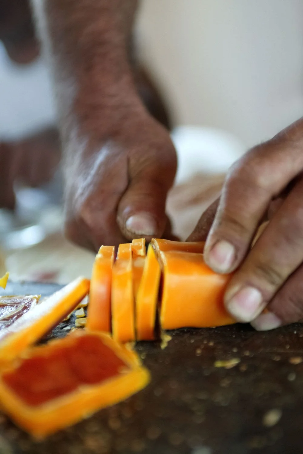 Artisanal bottarga cutting close-up, traditional food production detail by Stavros Kostakis Photography.
