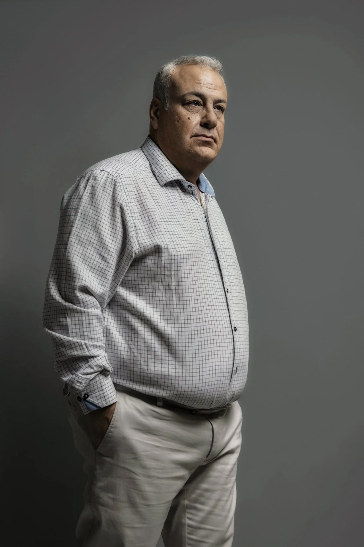 A formal yet character-driven portrait of Nikos Barbounis, Municipal Counselor. The lighting emphasizes the presence and the professional profile of the subject. Part of the Character Studies series by Stavros Kostakis.