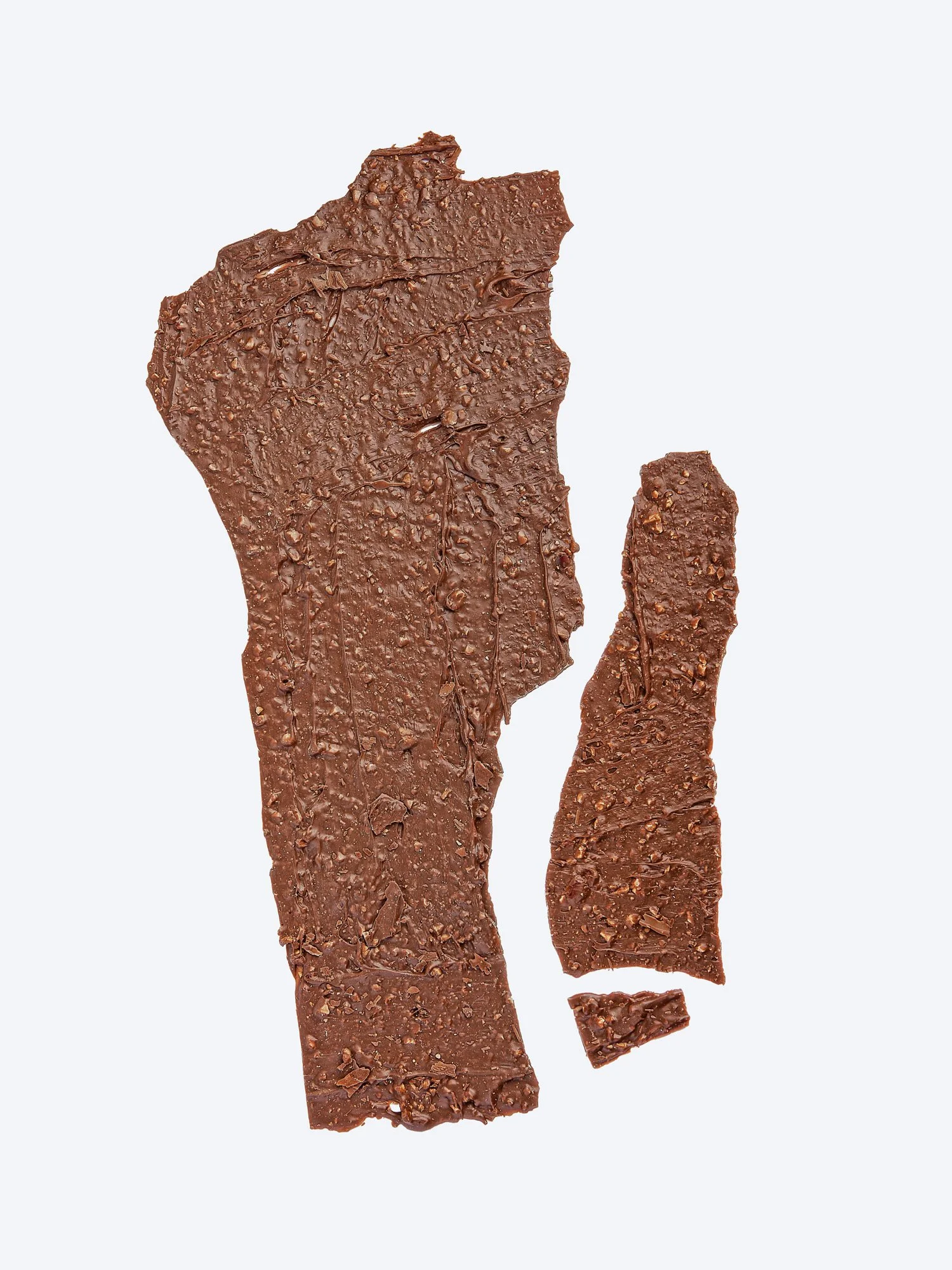 A high-detail study of broken artisanal chocolate pieces for the 'The Culinary Catalog'. This image emphasizes the raw texture and gold-dusted finish of the product, captured with professional precision on a neutral #F2F4F7 background for premium e-c