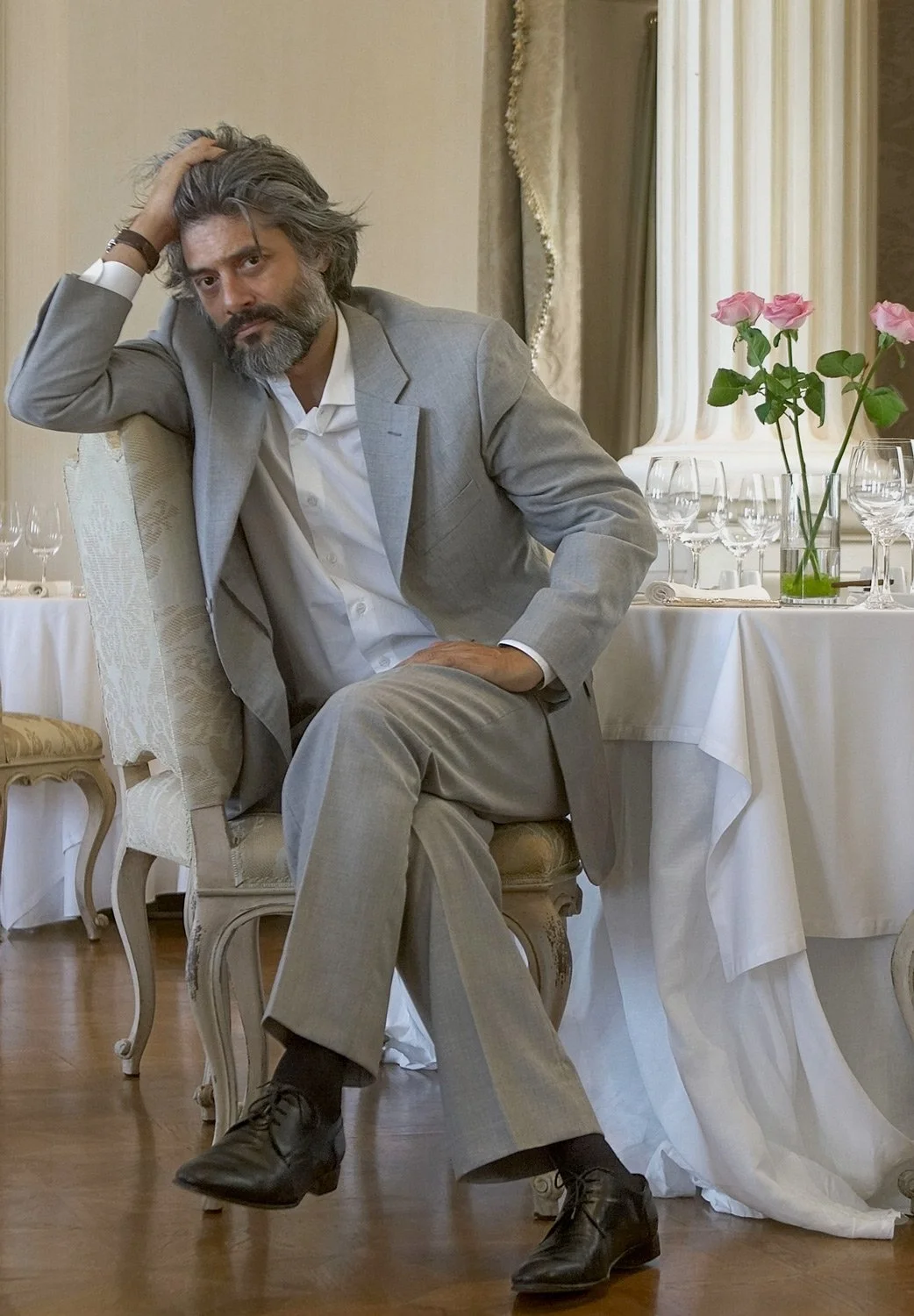 An intimate character study of George Chorafas, captured during an editorial session at a classic restaurant setting. This image explores the quiet, introspective side of the internationally acclaimed actor. Part of the "Character Studies" series by 