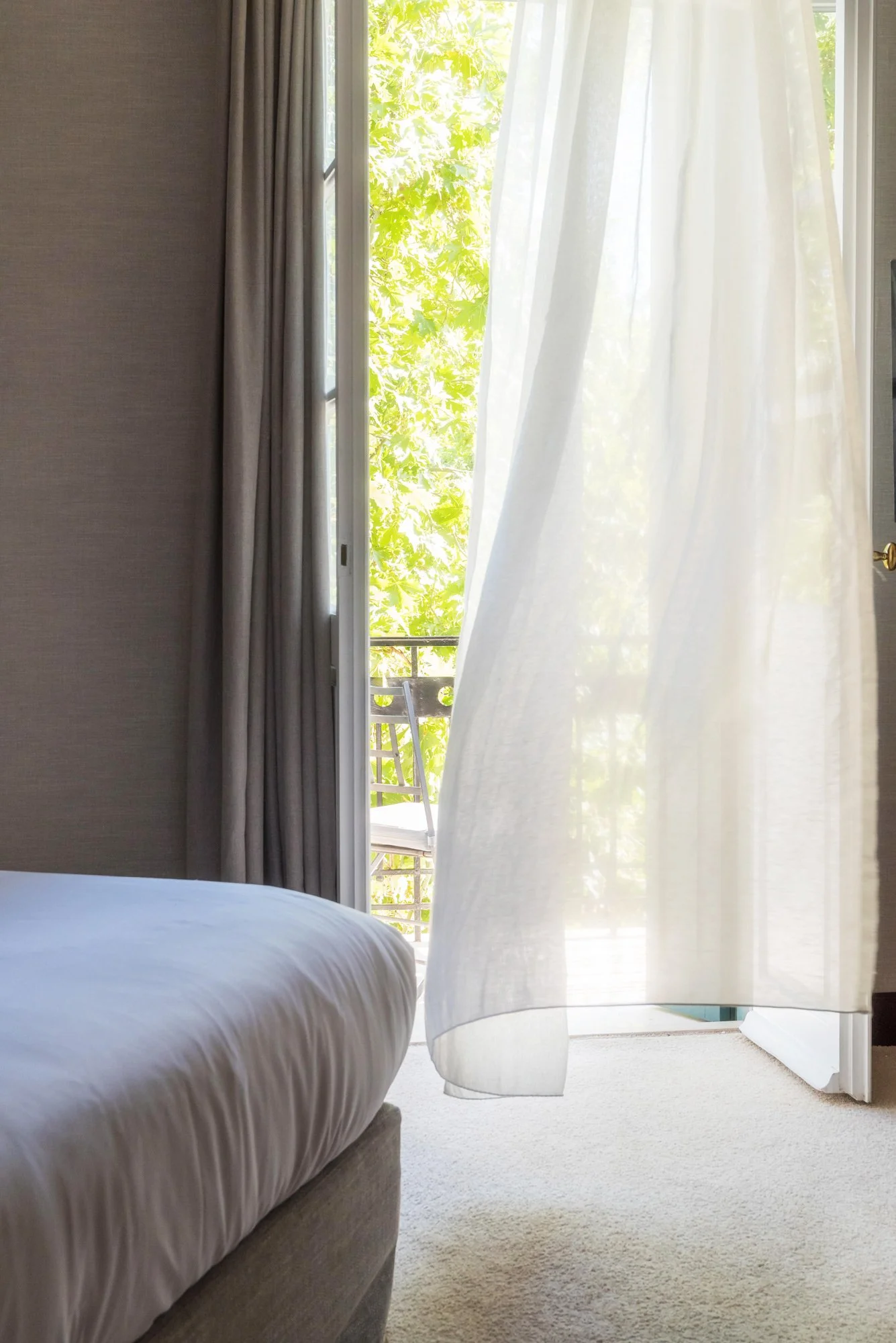 Kefalari Suites                                                  luxury boutique hotel | View   →   Ethereal interior photography of a luxury suite at Kefalari Suites, Athens. Natural light and soft curtain movement in a boutique hotel room by Stavro