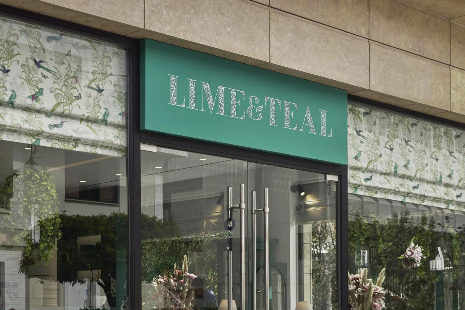 Close-up of the Lime & Teal brand signage and exterior glass entrance, photography by Stavros Kostakis Photography.