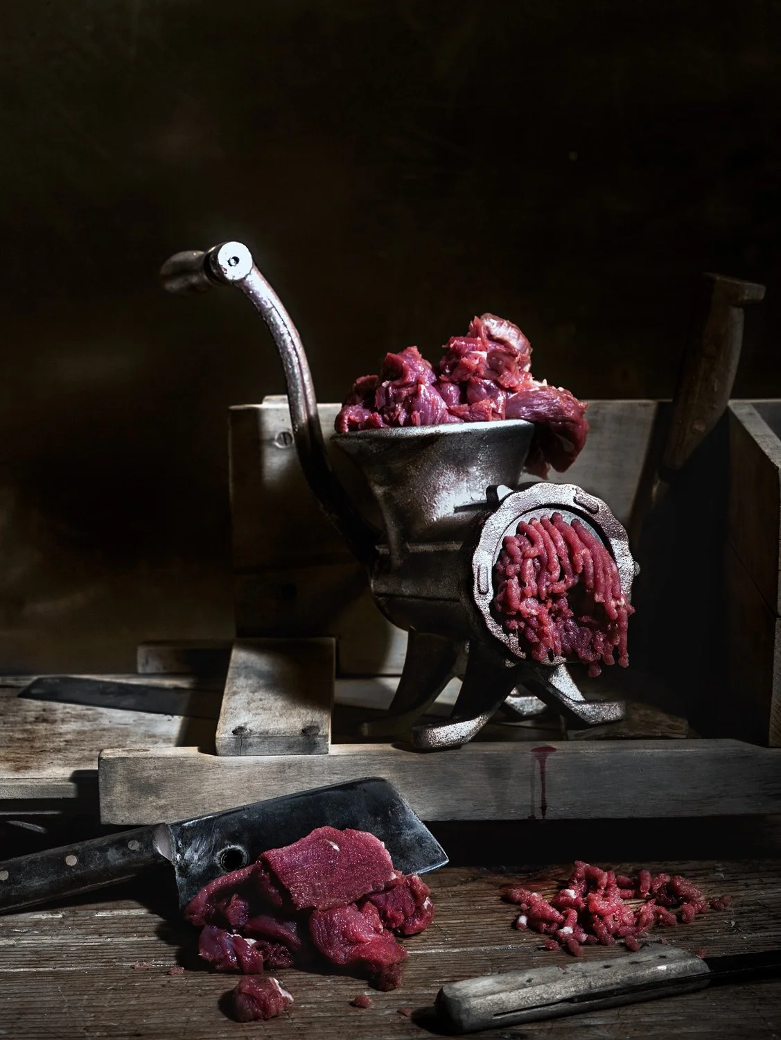 Drakoulis Meat Concept | Branding by Antonia Skaraki. Moody professional food photography of raw meat and vintage grinder for Drakoulis Meat branding by Stavros Kostakis.