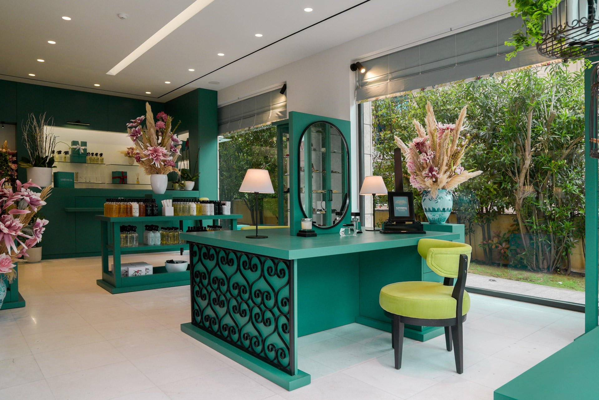 Interior view of custom teal cabinetry and lime seating area by Stavros Kostakis Photography for Kyparissou Architects.
