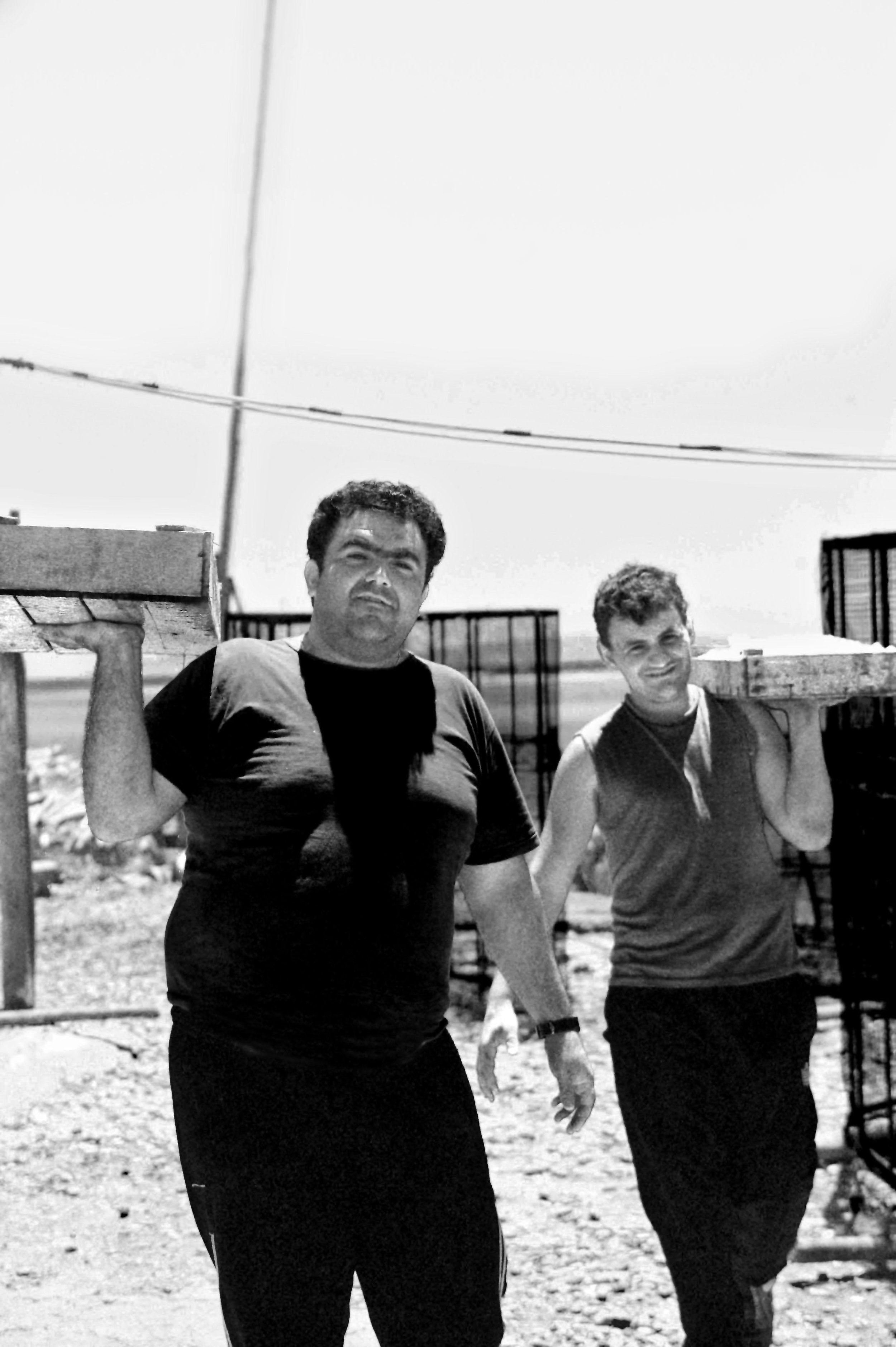 Traditional workers in the Aetoliko lagoon, documentary photography of manual labor by Stavros Kostakis Photography.