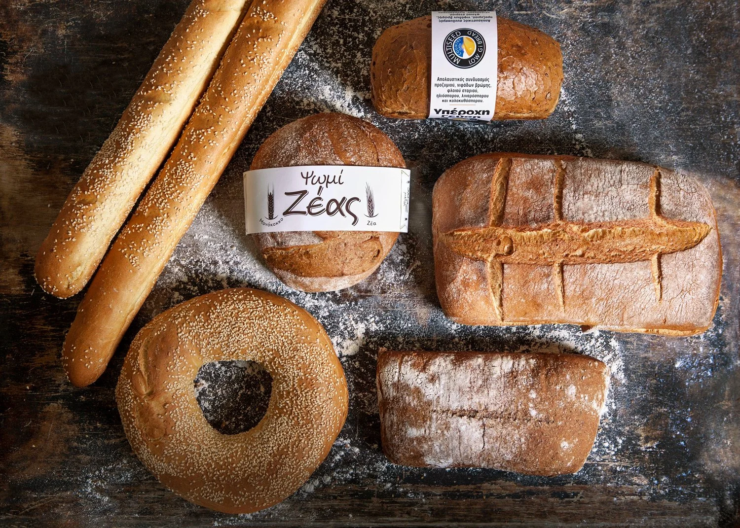 Vyzantion Bakery Athens. Crafting the visual identity for one of Athens' traditional bakeries. This commercial still life for Vyzantion Bakery highlights the rich variety of artisanal breads, from Zeas to multiseed loaves, emphasizing the rustic text