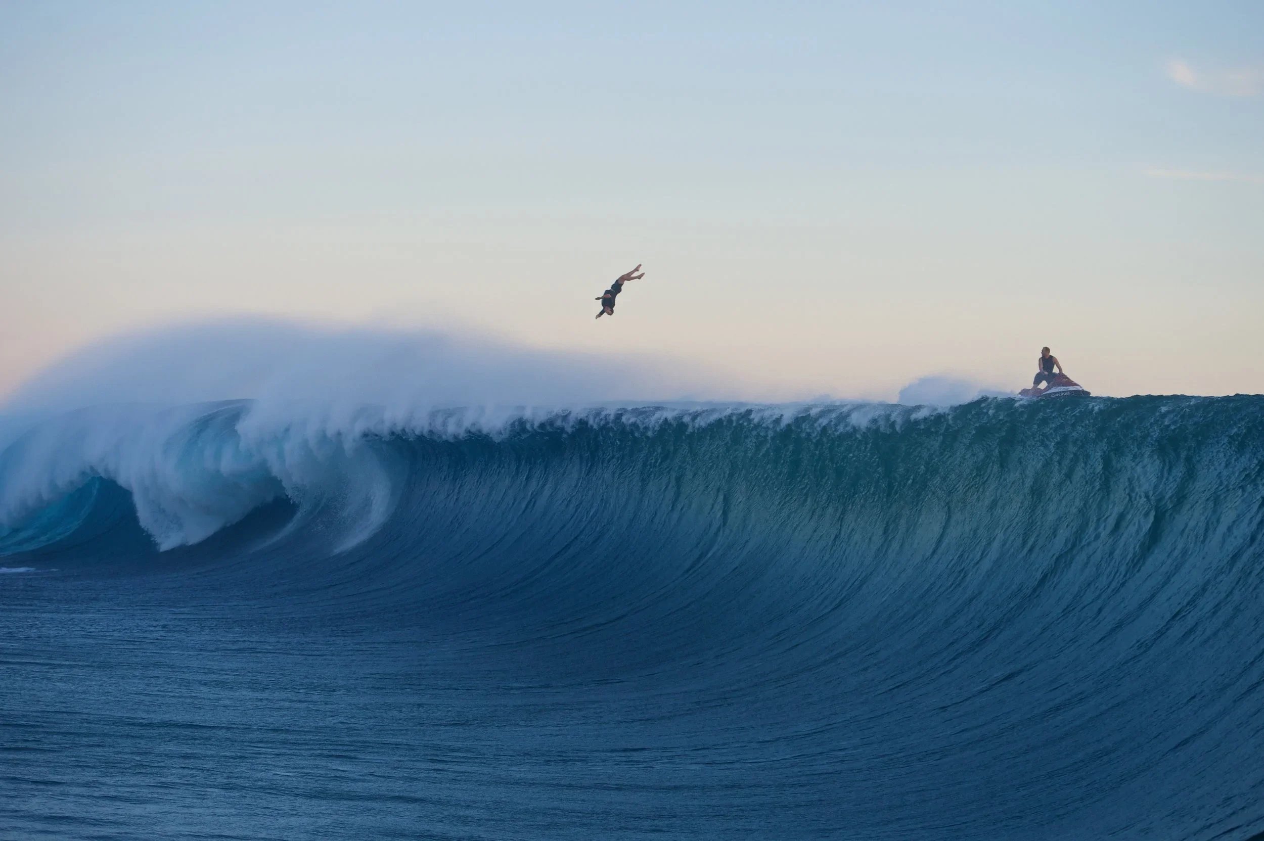Mark Visser skilfully bailing off the back of a huge wave at Teahupo'o, Tahiti