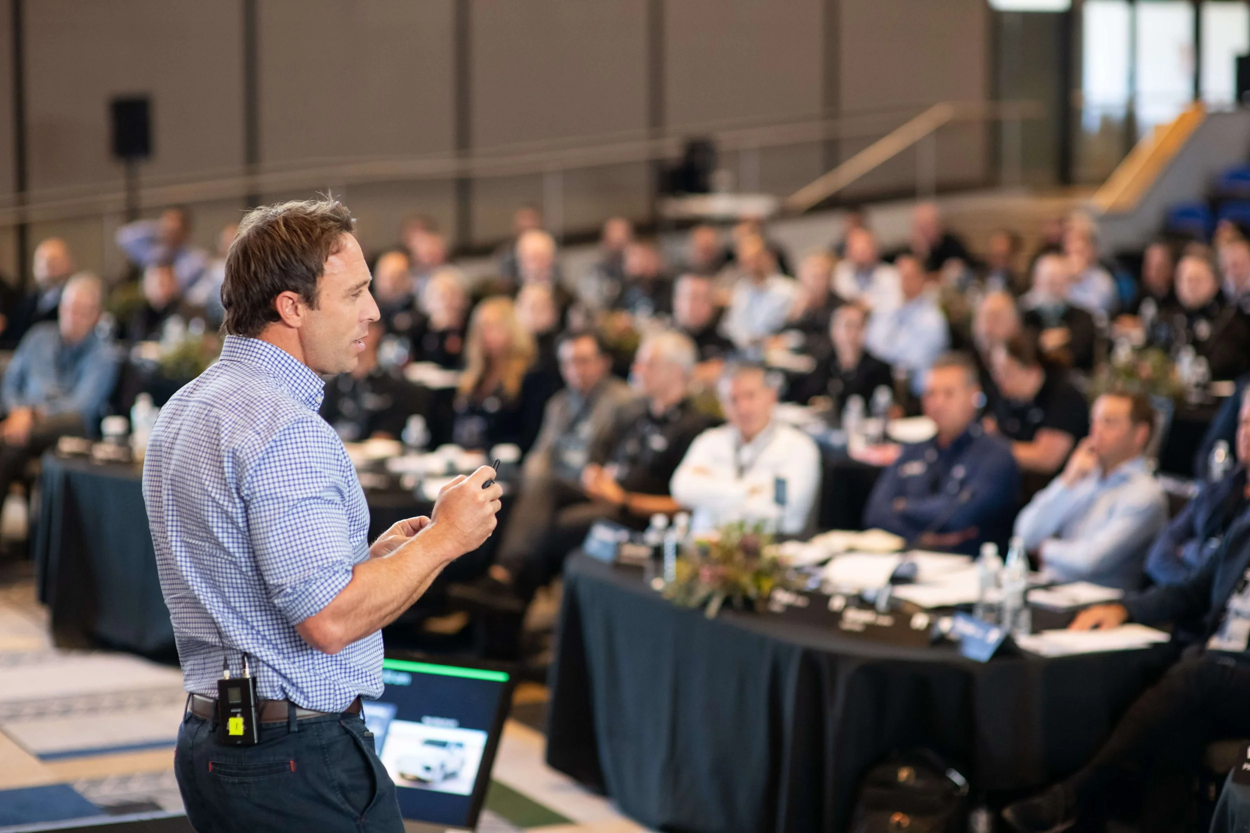 Leadership keynote speaker Mark Visser speaking to business leaders at a conference.