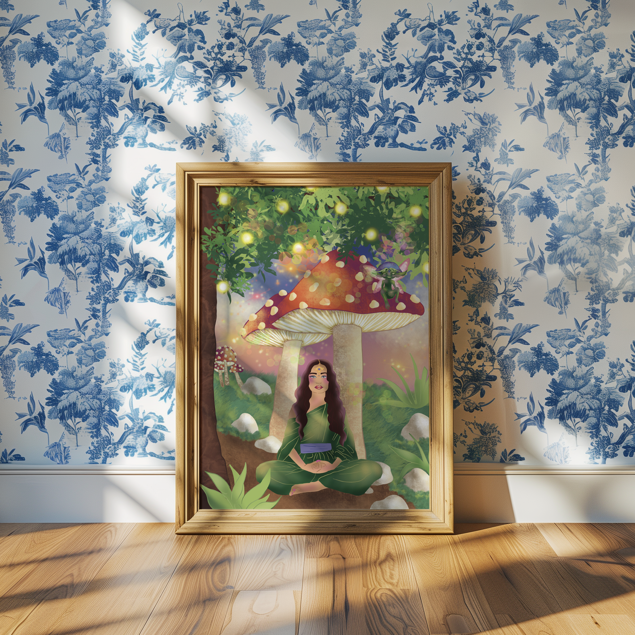 A framed colorful painting of magical mushrooms and a mythical creature, hung on a wall with blue and white floral wallpaper, with a wooden floor below.