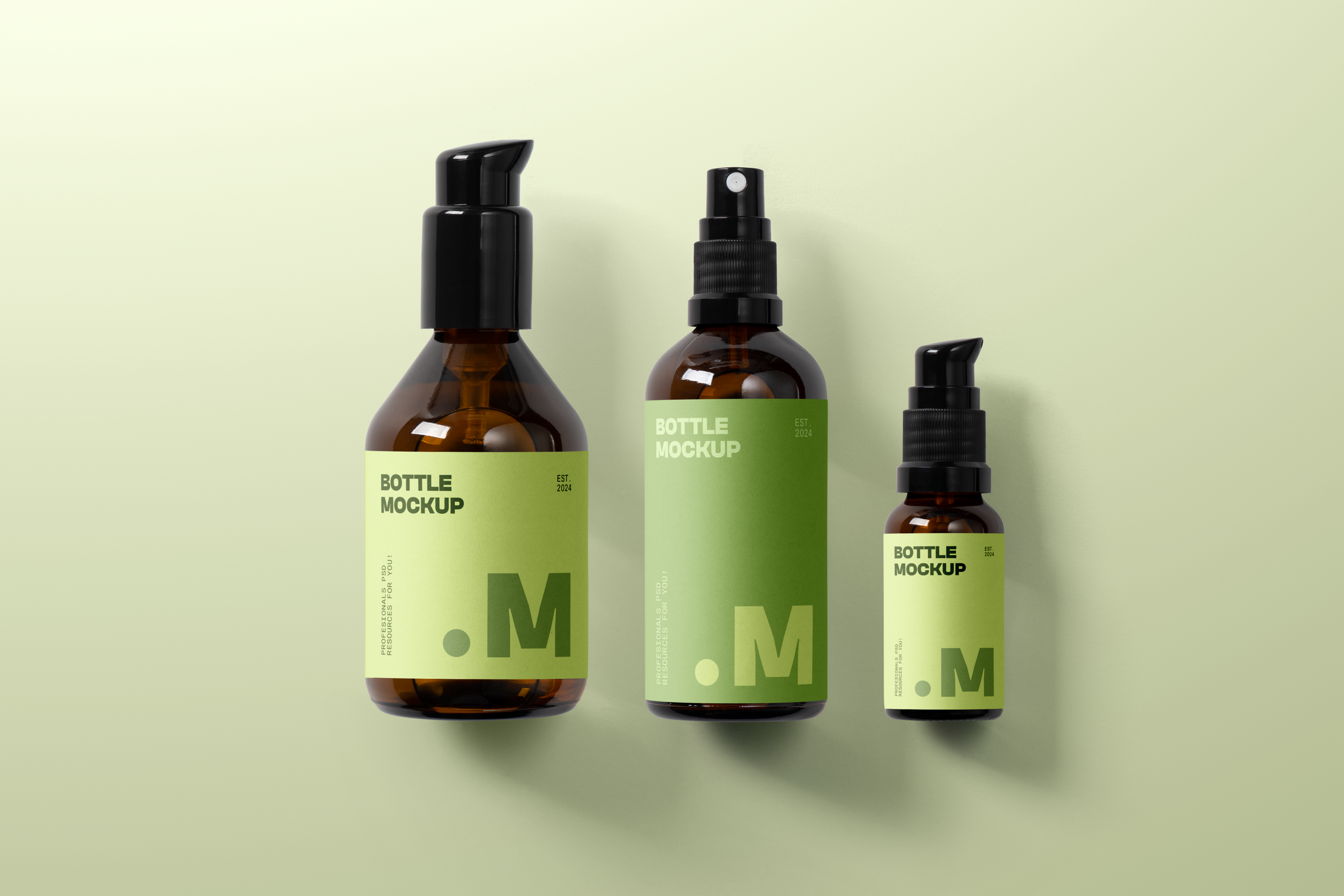 Three brown glass bottles with black spray tops on a light green background. The bottles have green labels that read "Bottle Mockup" and "Est. 2024."