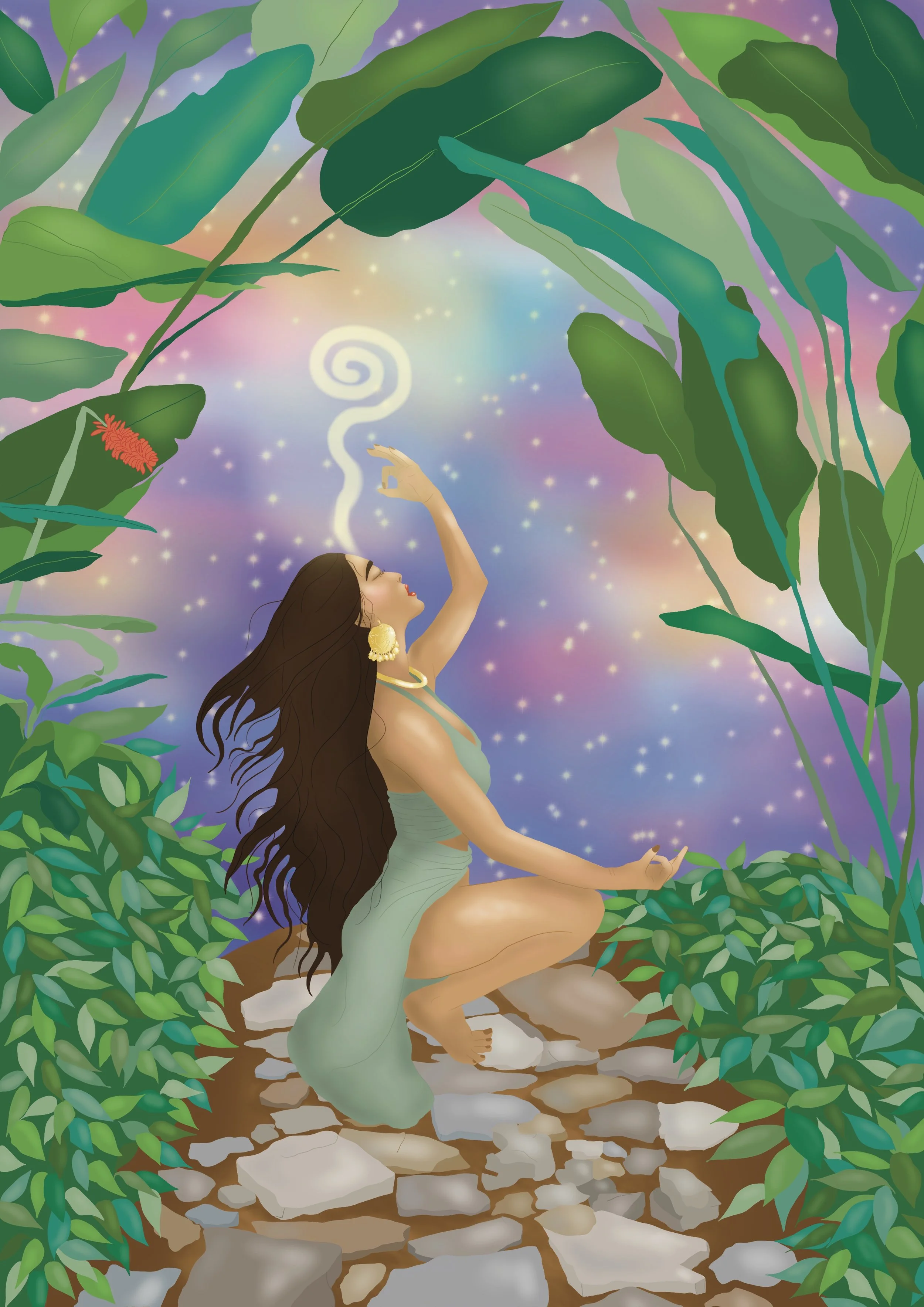 A woman with long, flowing dark hair and gold earrings is sitting on a path of rocks surrounded by lush green plants and leaves. She is dressed in a pale, flowy garment and is performing a meditative pose with her eyes closed and her right hand raise