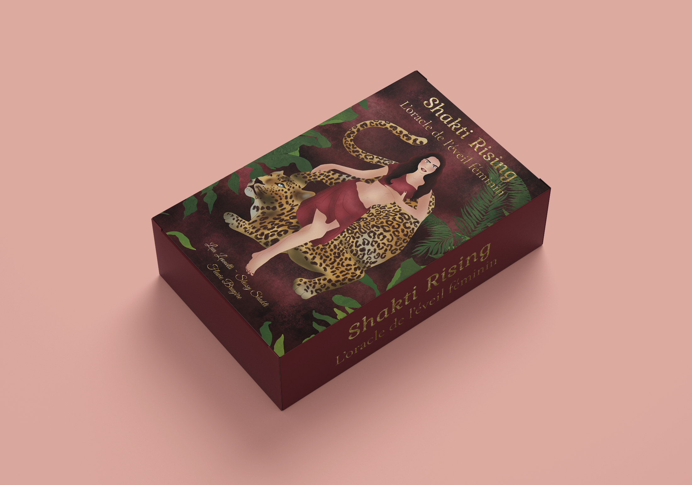 A book titled 'Shakti Rising: L'Oracle de l'éveil féminin' with an illustration of a woman in a red dress, a leopard print snake, and lush green tropical leaves on the cover, set against a dark background.