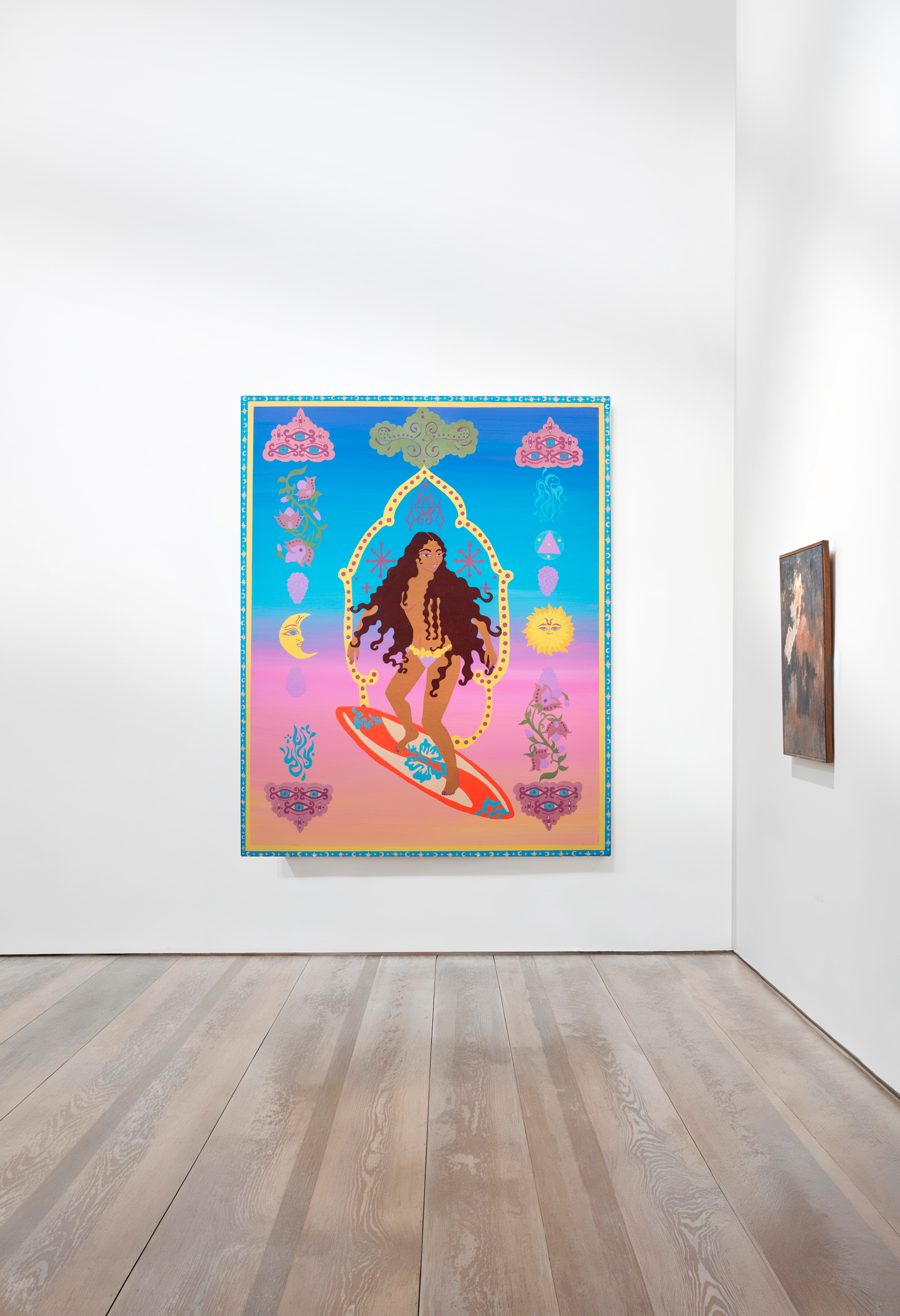 Artwork depicting a woman with long, wavy hair riding a surfboard with a sunset background and mystical elements like moons, suns, clouds, and abstract symbols.