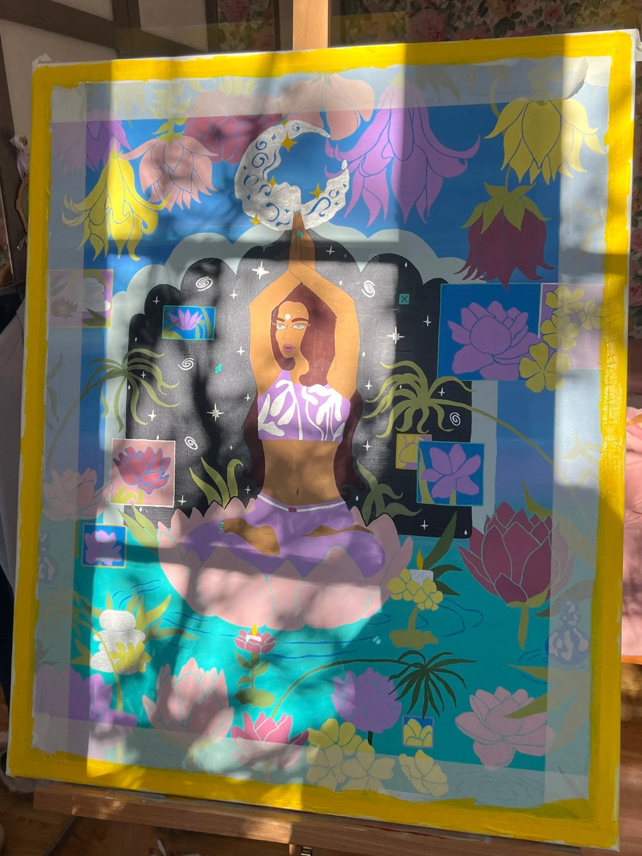A colorful artistic illustration featuring a woman practicing yoga or meditation with a celestial moon above her head, surrounded by flowers and leaves, and a vibrant background with various decorative elements.