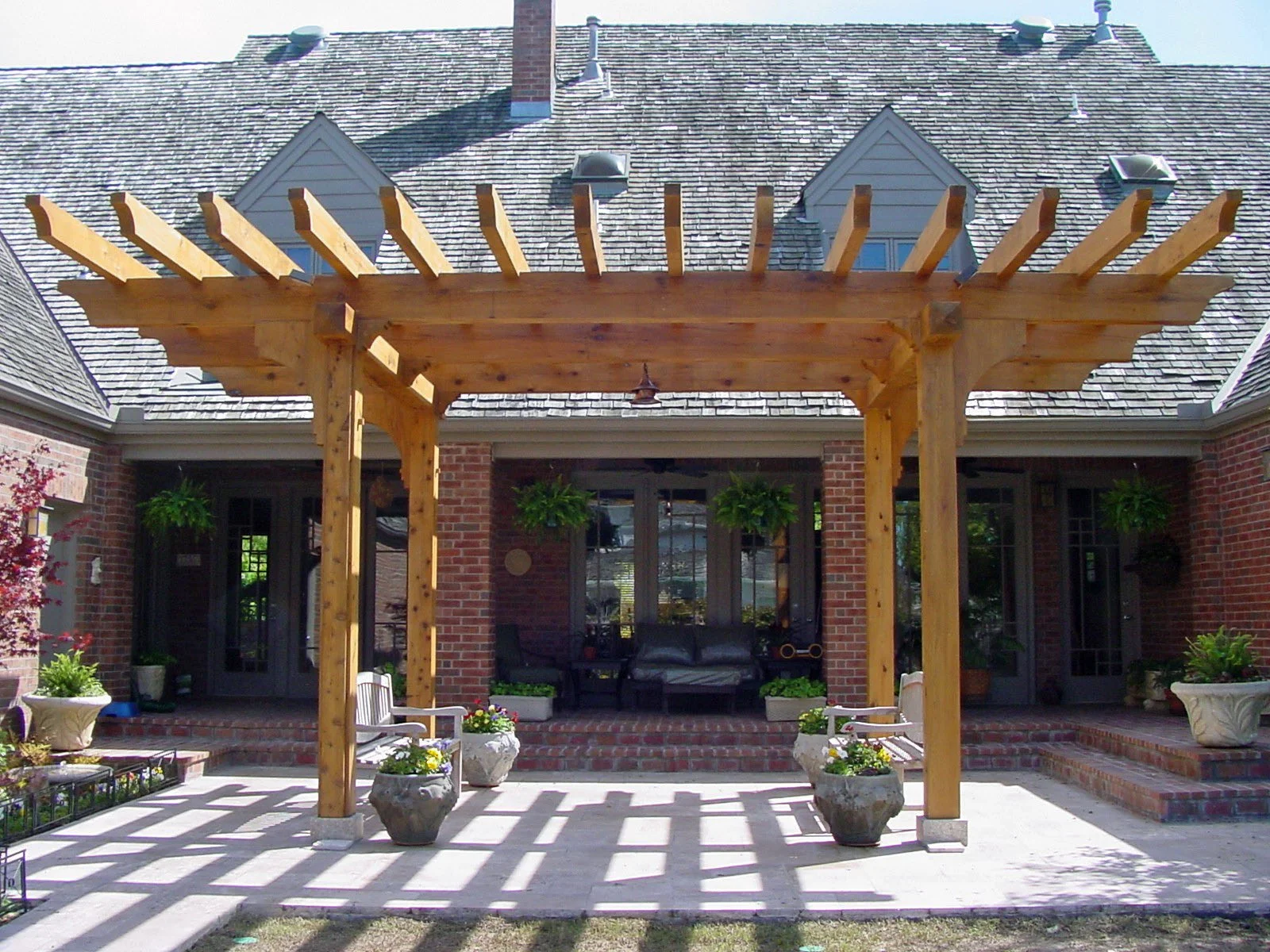 Custom outdoor arbor in Tulsa adding shade and architectural detail to the landscape