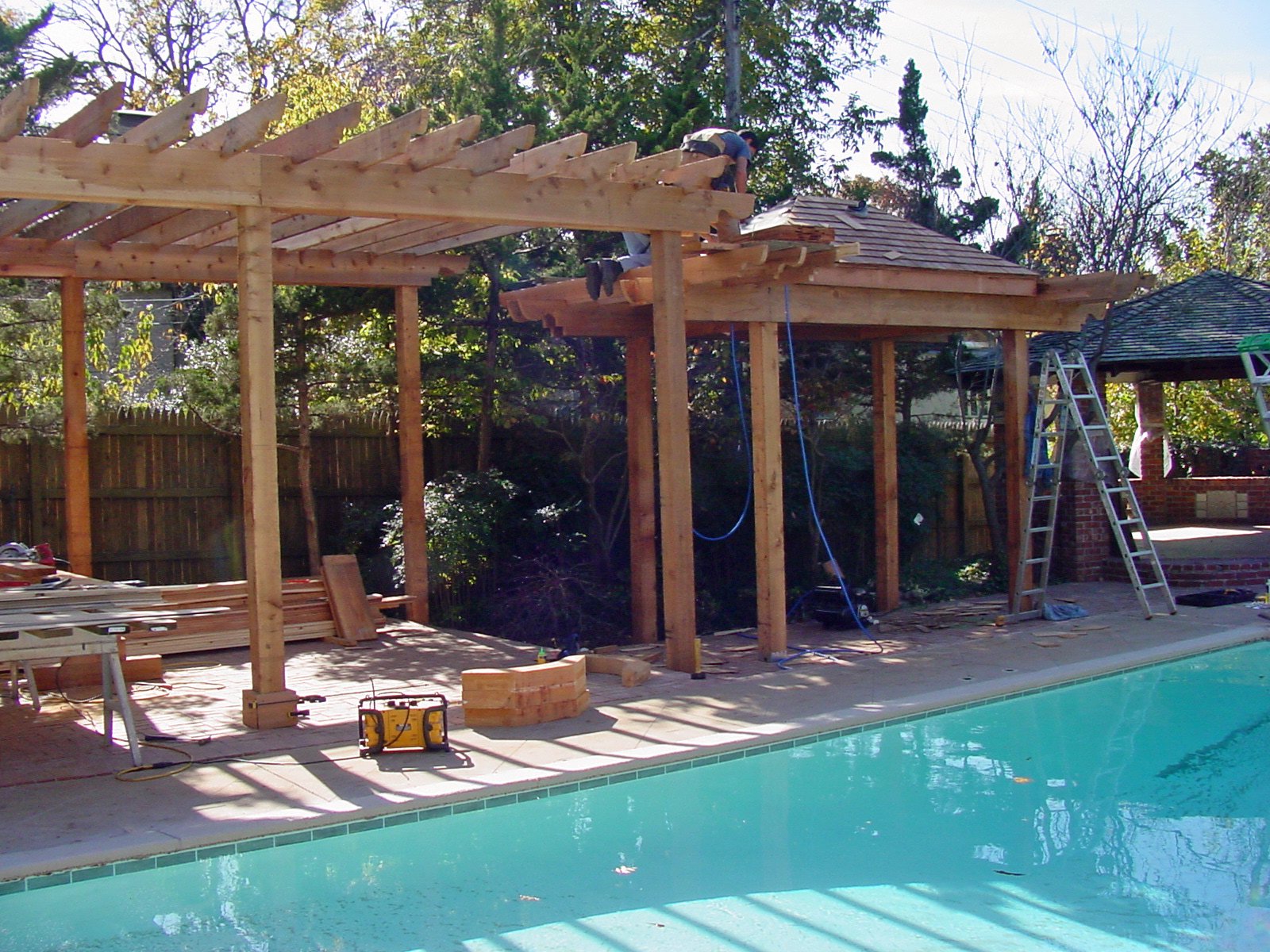 Arbor and landscape design in Tulsa with plants, pathway, and garden structure