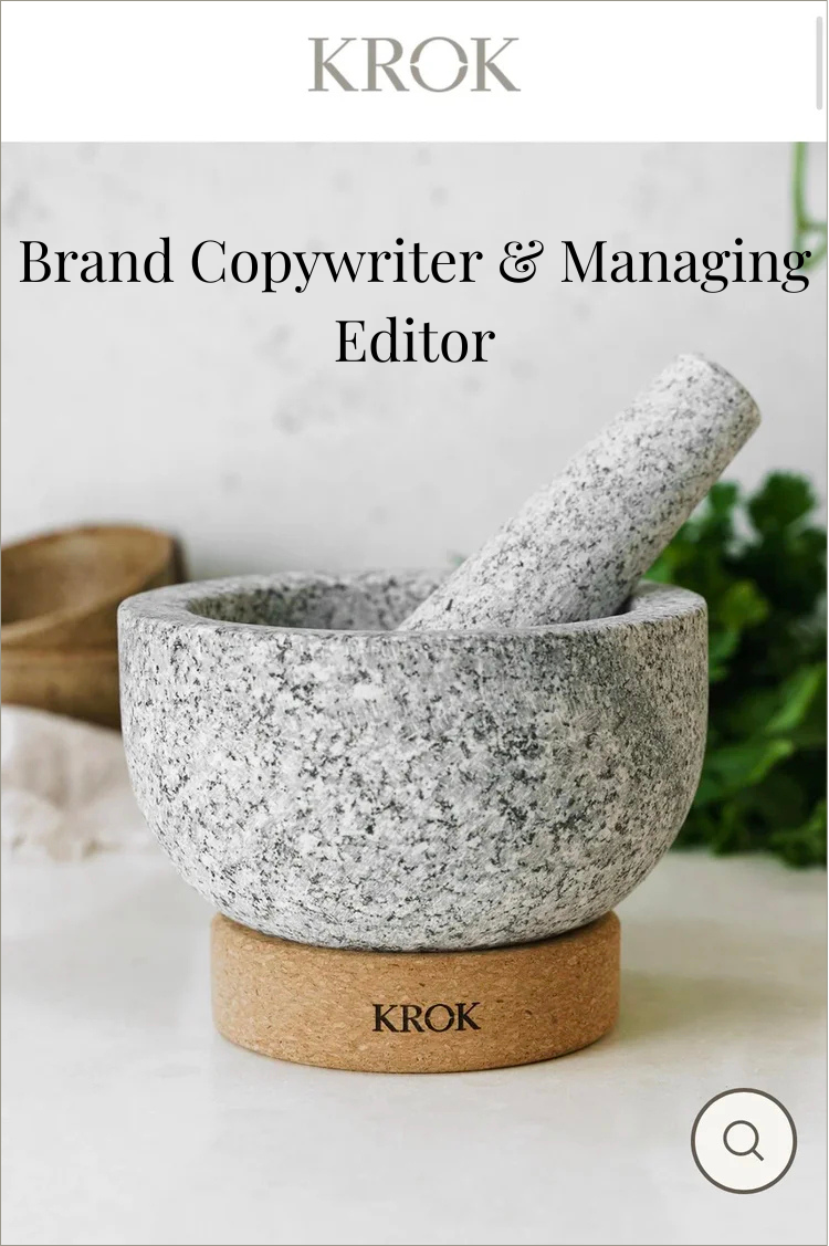 KROK logo at the top, with a granite mortar and pestle in the foreground. The mortar is placed on a round, brown base with the KROK brand name, and there are blurred leaves and a wooden spoon in the background.