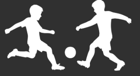 Silhouettes of two children playing soccer, running towards a ball.
