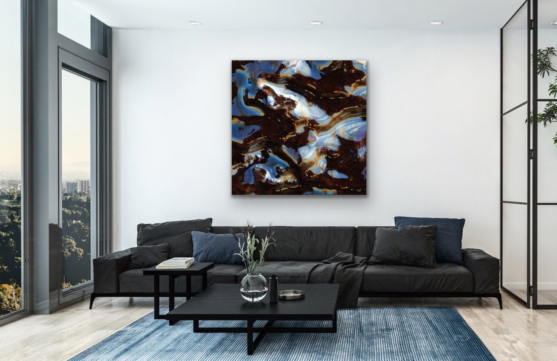 Large abstract acrylic artwork in contemporary interior white wall, black sofa with pillows