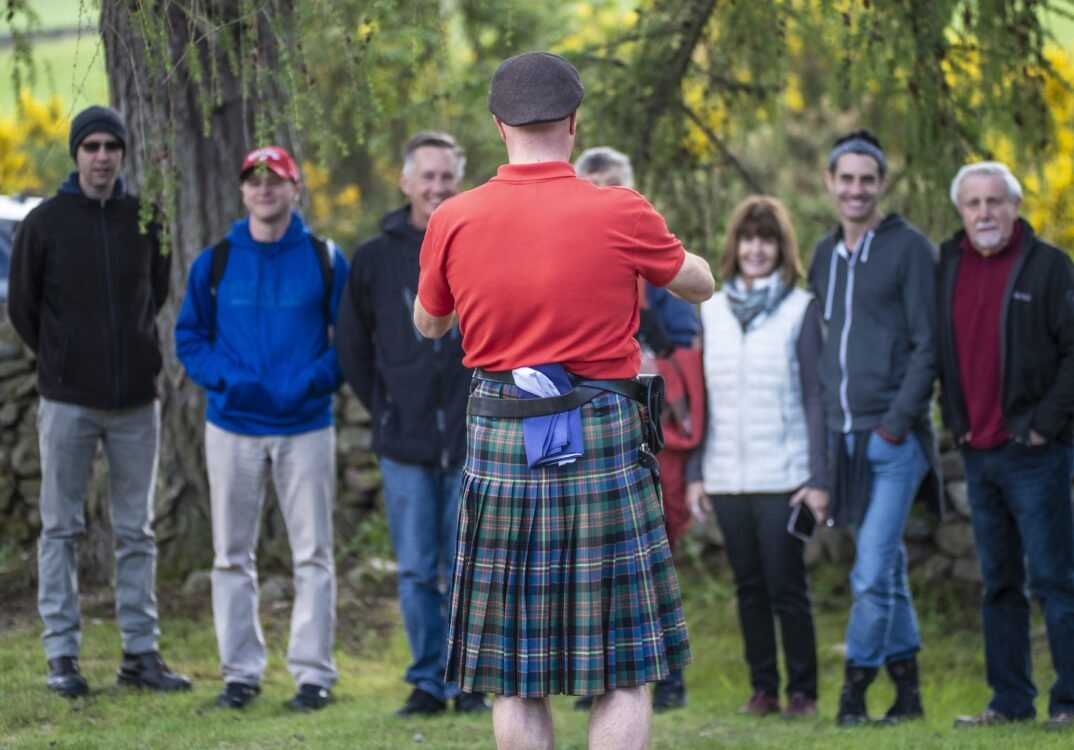 Tour guide takes a group photo