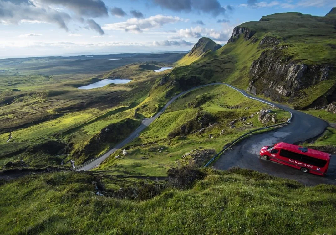The Wee Red Bus on the dramatic Quiraing mountain pass