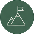 Icon of mountain with a flag on top.