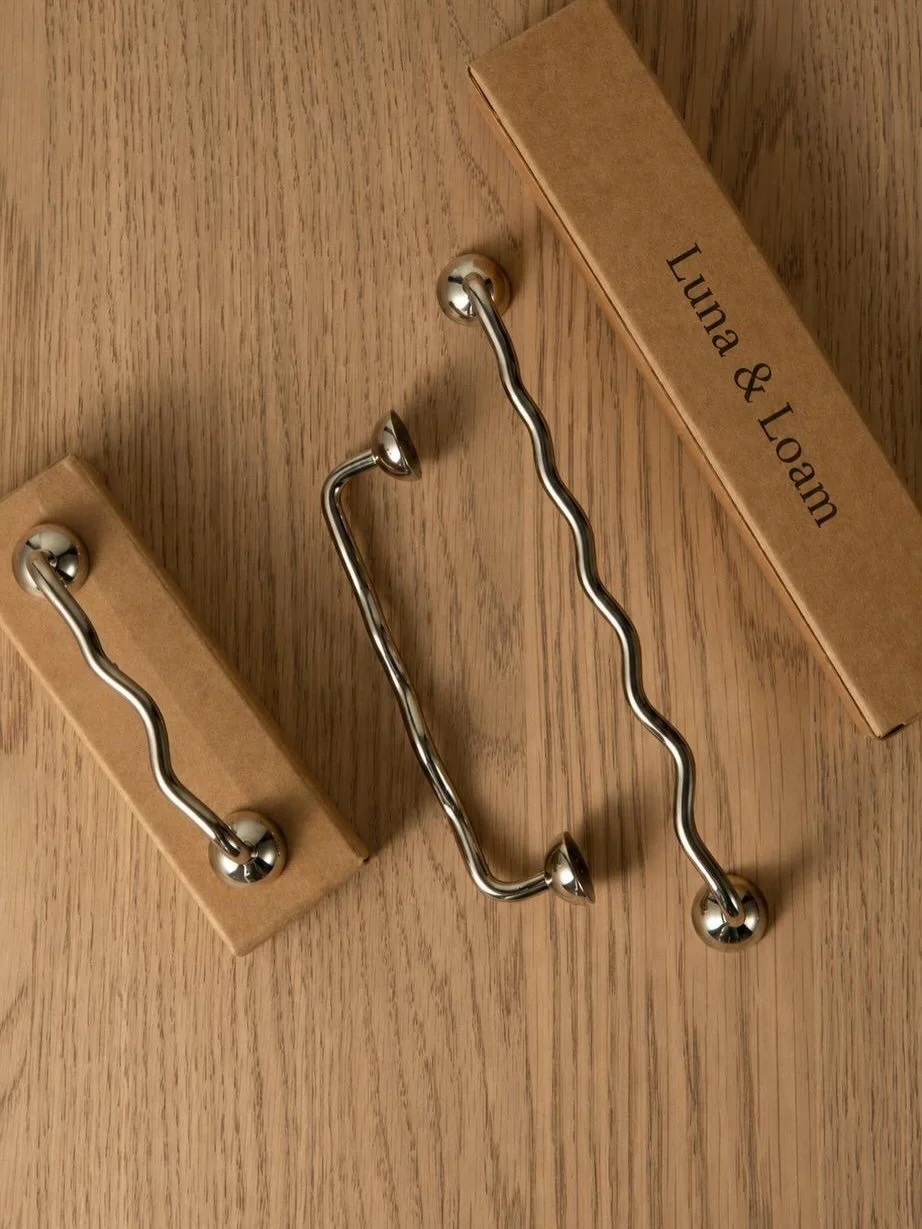 The Ceylon Collection

Chrome, but never cold.
A sculptural take on handles, The Ceylon Collection introduces gentle organic curves that feel fluid, effortless, and quietly unexpected. Its undulating silhouette softens hard surfaces, bringing movemen