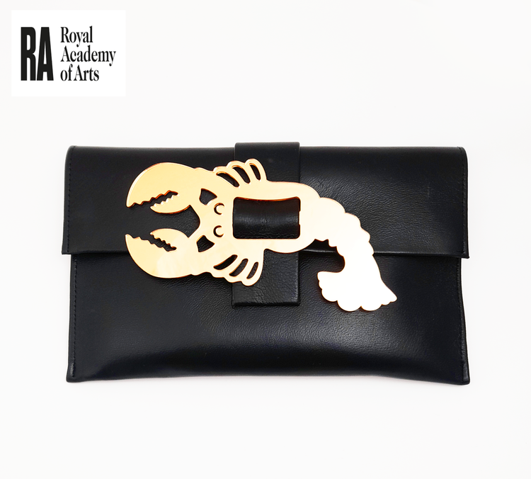 Black clutch purse with a lobster-shaped cutout in beige on the front, placed on a white background with a Royal Academy of Arts logo.