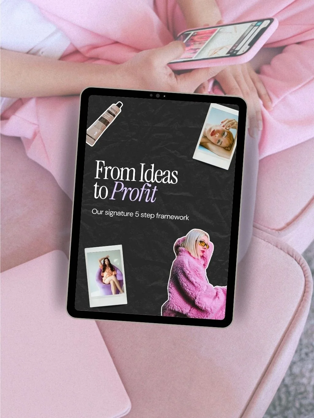 A tablet displaying a presentation titled "From Ideas to Profit" with images of women, a tube of cream, and a woman in a pink fuzzy coat, resting on a pink surface with a person using a smartphone in the background.