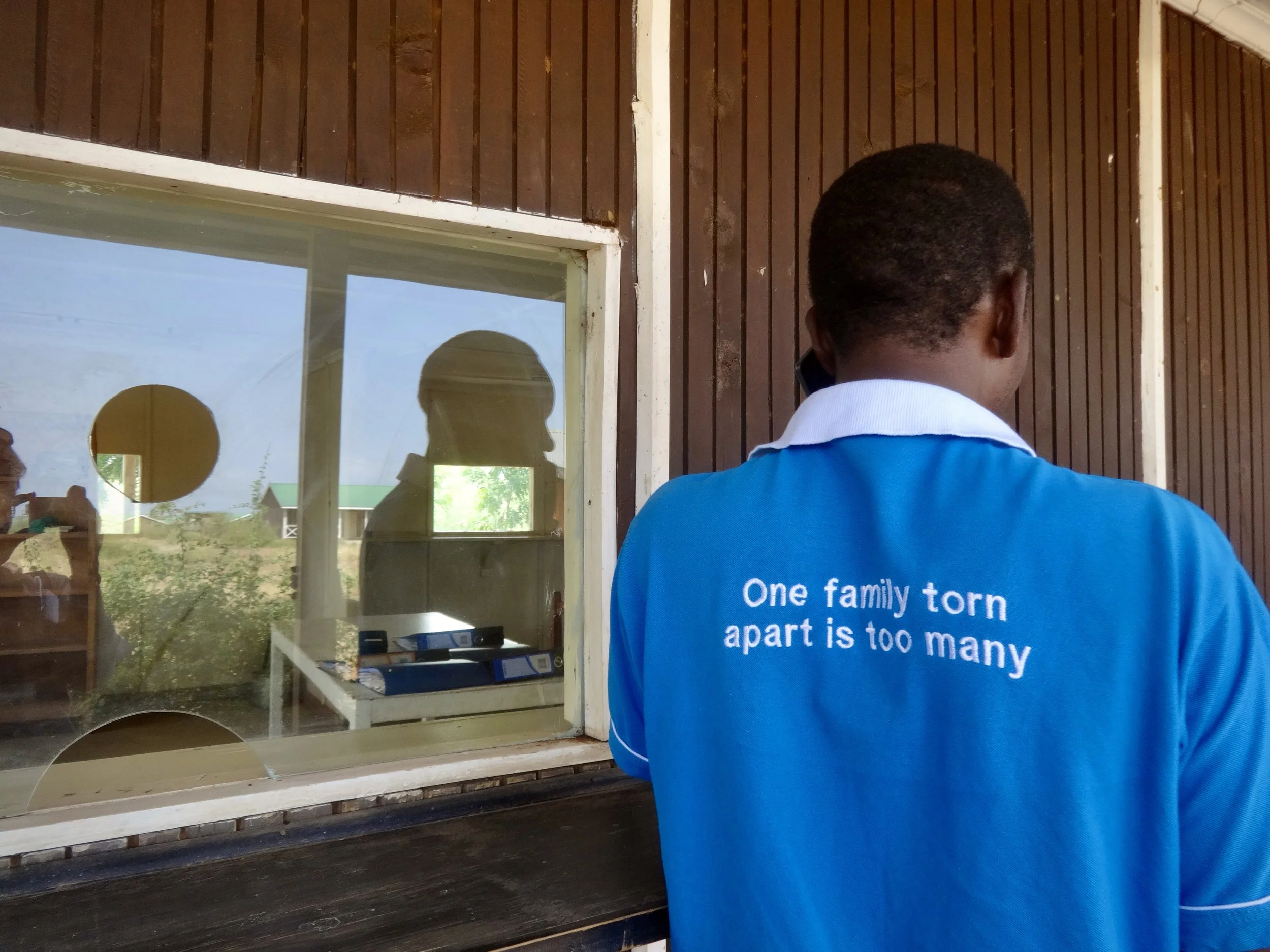 A man stands at the immigration counter. During this period, asylum seekers were being instructed to enter Kenya on a paid visitor permit rather than register for asylum.