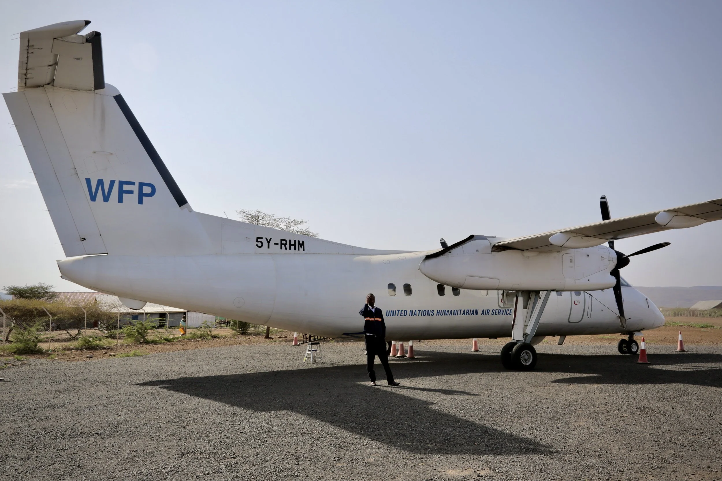 A UN flight prepares to depart from northern Kenya with refugees approved for relocation. For those on board, departure meant safety, separation, and an uncertain future beyond the camp.