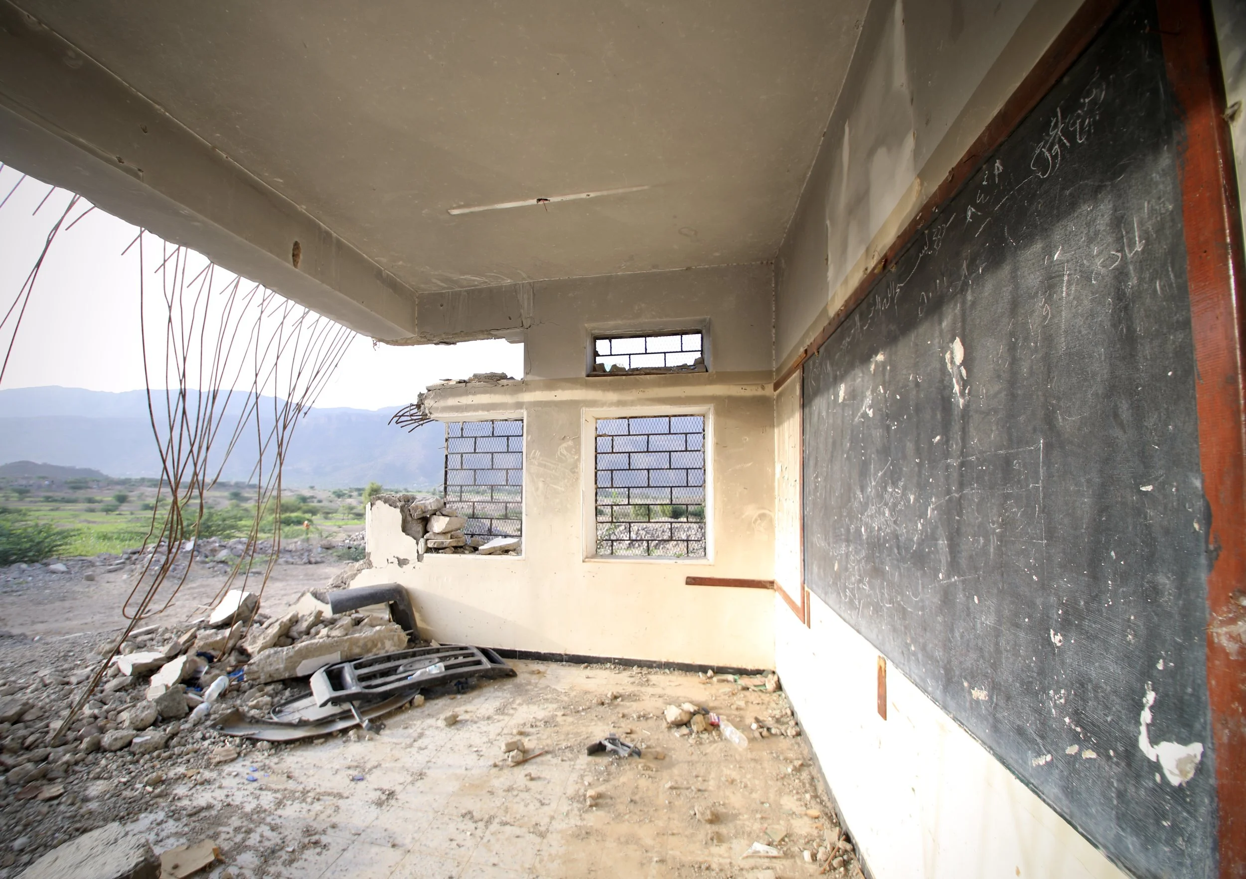 A classroom inside Al Shaab School remains exposed after part of the building was destroyed during the conflict.