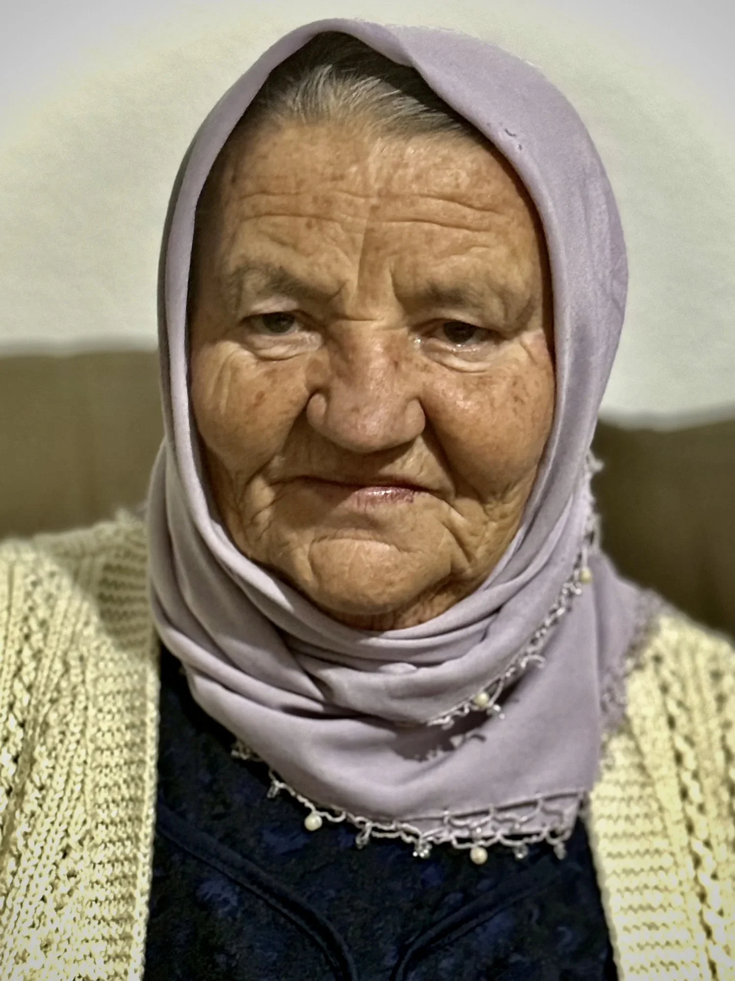 Saliha Osmanović at her home in Dobrak, Bosnia and Herzegovina, in 2025.
Thirty years after the Srebrenica genocide, she lives alone in the house where she once lived with her husband Ramo and sons Nermin and Edin. “You are all my children now,” she 