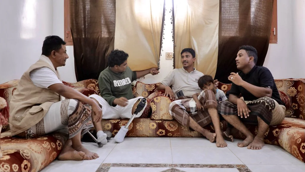Saeed, Mohammed, Sami and his son, and brother Ousama gather together inside the home at the end of the day. Three generations of men in the family have worked in mine clearance along Yemen’s western coast.