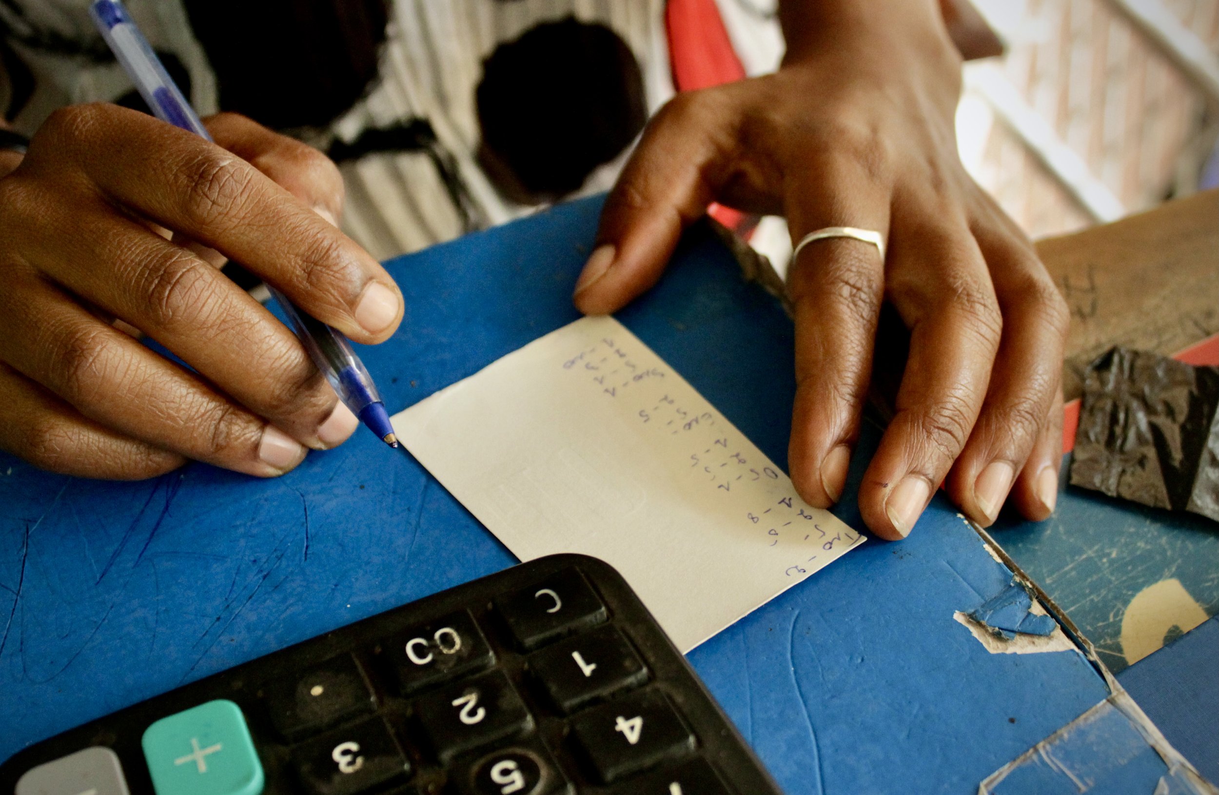 Sales figures are recorded at the Fido Dido grocery store. Employees estimated customer numbers had fallen by around 25 percent since the beginning of the political crisis.