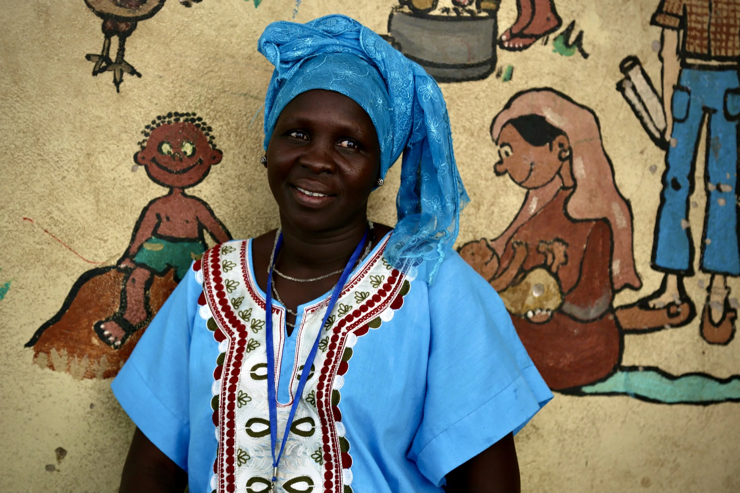 Rose Akwero Lee, a refugee staff member at the Safe Haven, poses inside the compound. Refugee women themselves formed the backbone of support services there.