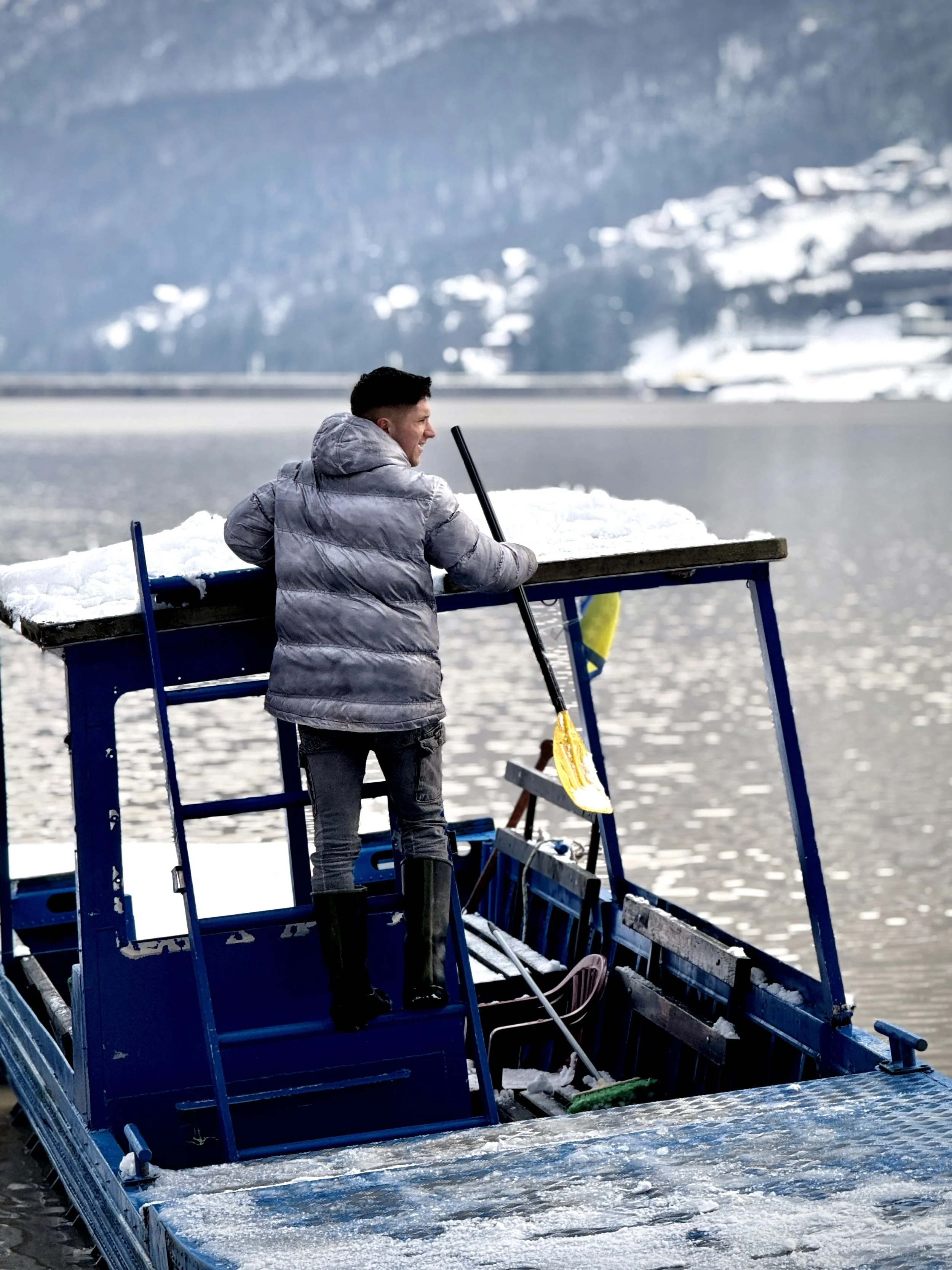 A young Bosniak boy crosses the water near Petkovci. A small Bosnian flag hangs from his boat - a silent act of identity in Republika Srpska, where Serbian flags are far more commonly displayed. He is one of Begija’s former students, part of a genera