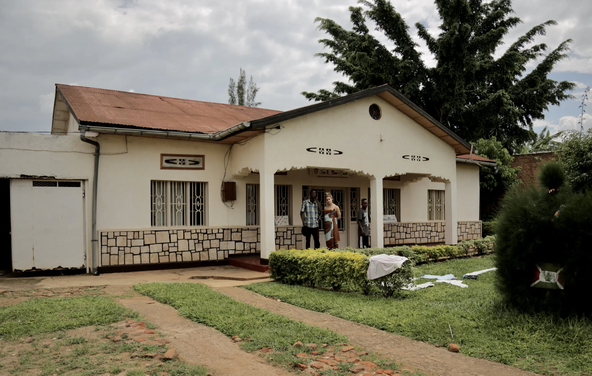 Burundian refugees gather outside the house they shared in Kigali, Rwanda, after fleeing political violence in Burundi following President Pierre Nkurunziza’s controversial third-term bid in 2015. The photograph was self-shot by Elsa Buchanan while s