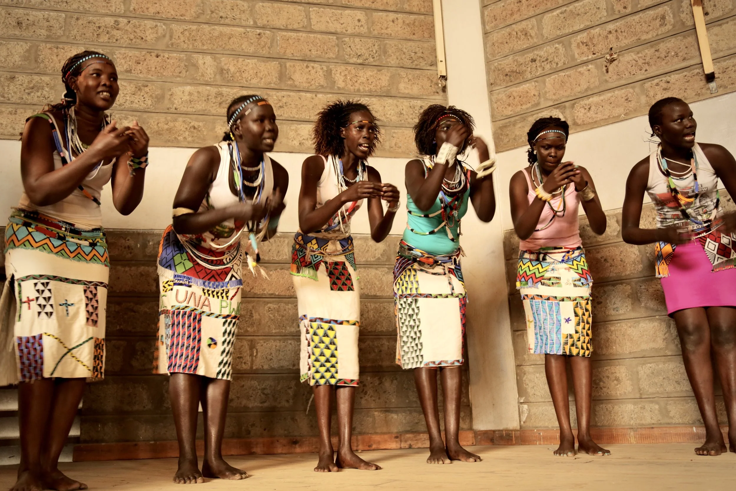 Refugee performers present a traditional dance during World Refugee Day celebrations organised by KCCB and JRS at Divine Word Church in Nairobi.