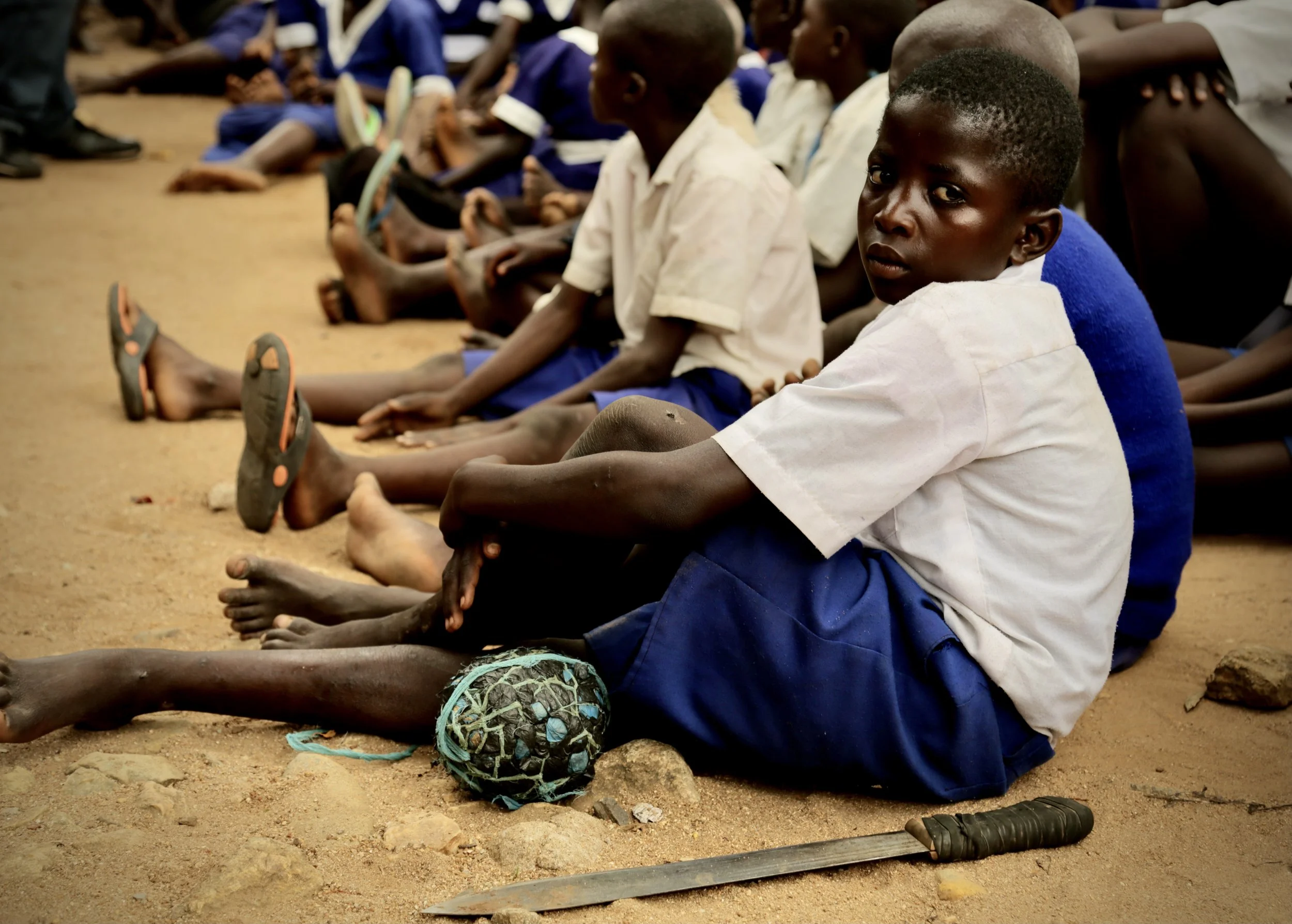 A pupil sits among classmates during a gathering at Albertos Divine Providence School in Kakamega County, Kenya. Access to clean water and sanitation is closely linked to health, attendance and educational achievement.