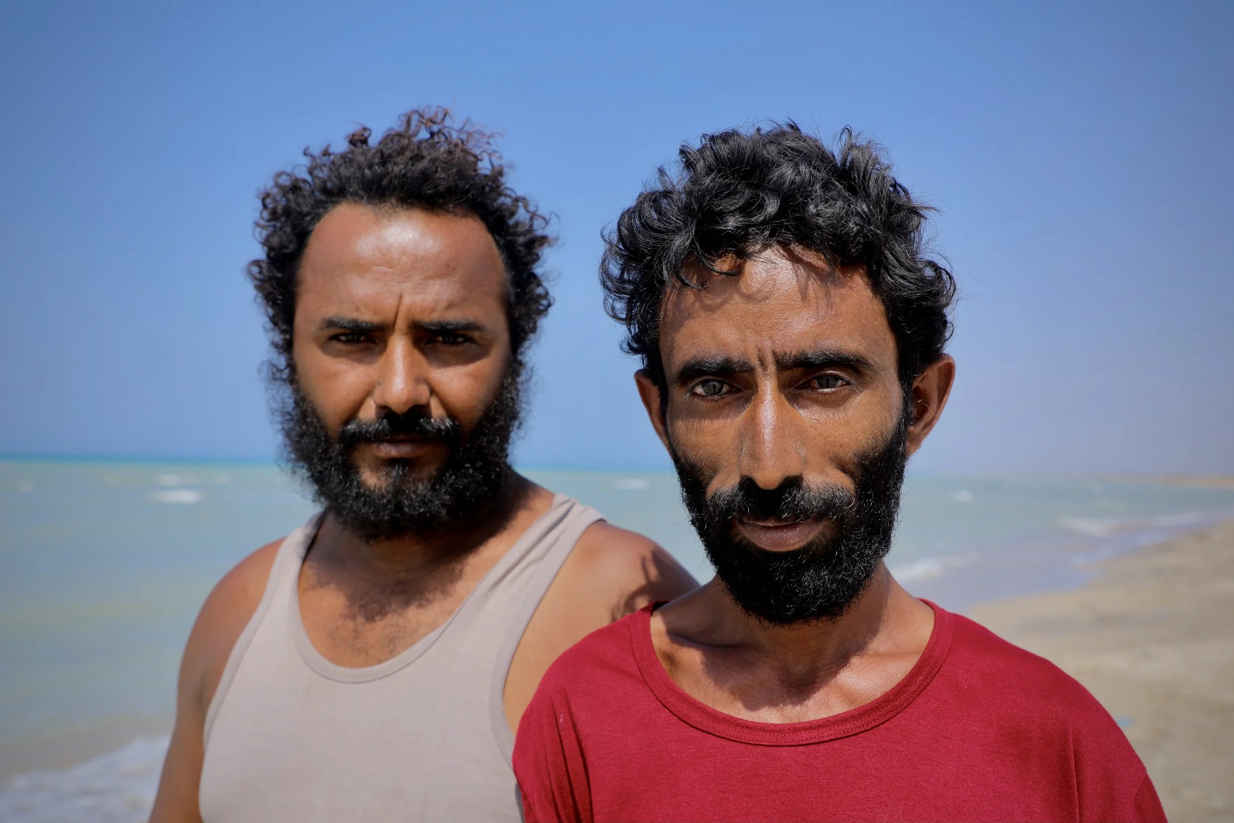 Fisherman Abdullah Omar Mohamed and a friend (also fisherman) say fear spread through their community. Al Khokha, Yemen.