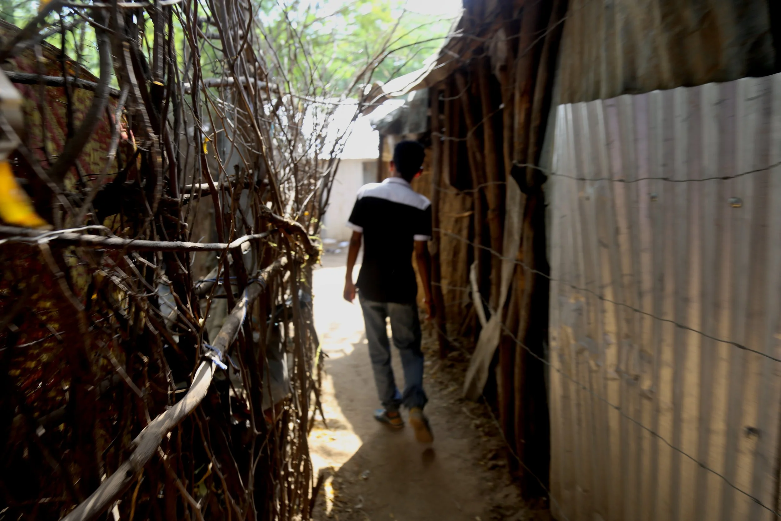 Nazrit moves through the narrow paths of Kakuma, where his family rebuilt life after being forced to leave Nairobi and relocate to the camp.