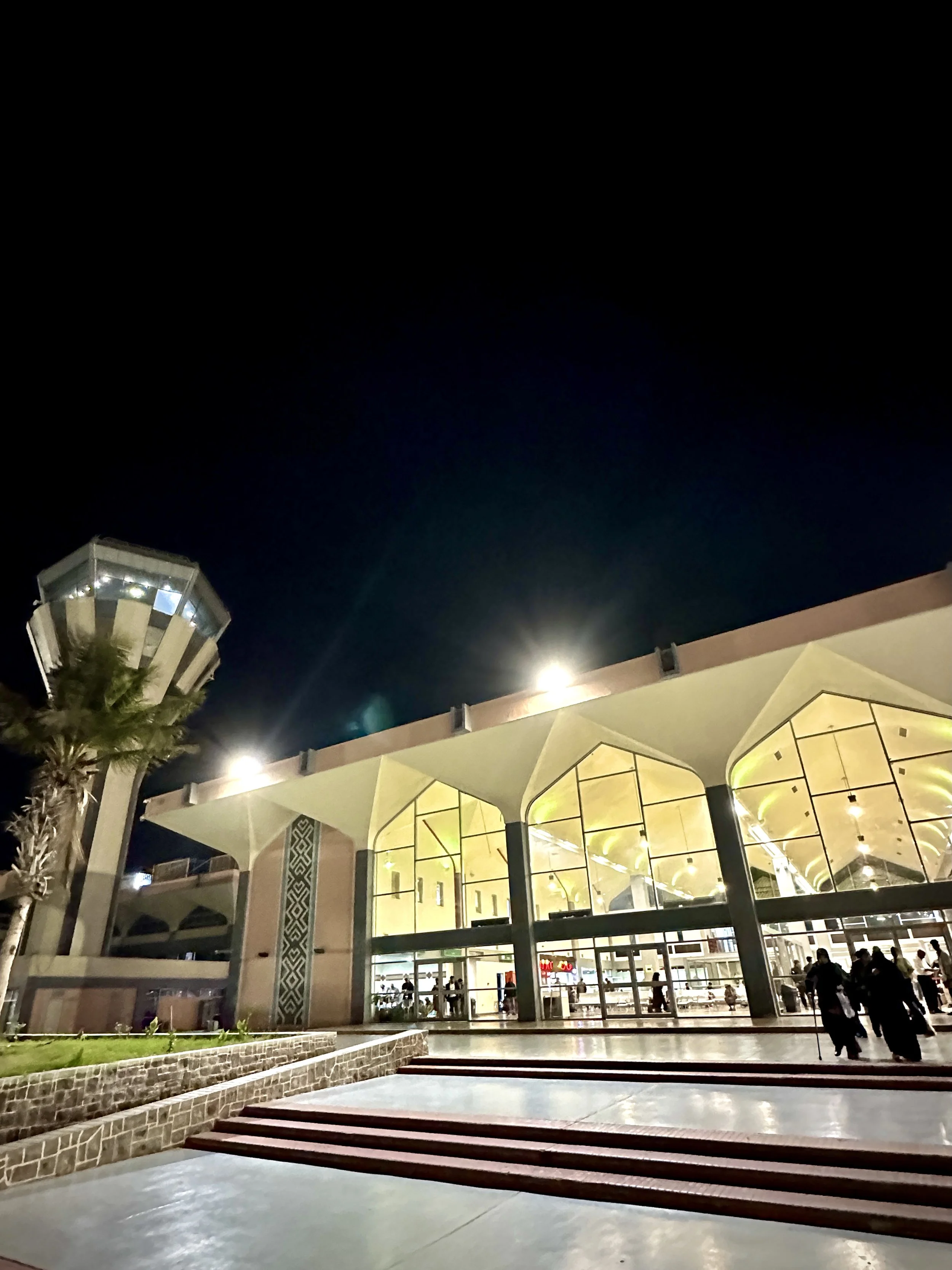 Aden International Airport illuminated at night. New reconstruction funding announced in 2026 includes restoration works, runway rehabilitation and upgraded navigation systems aimed at improving safety and expanding operations.