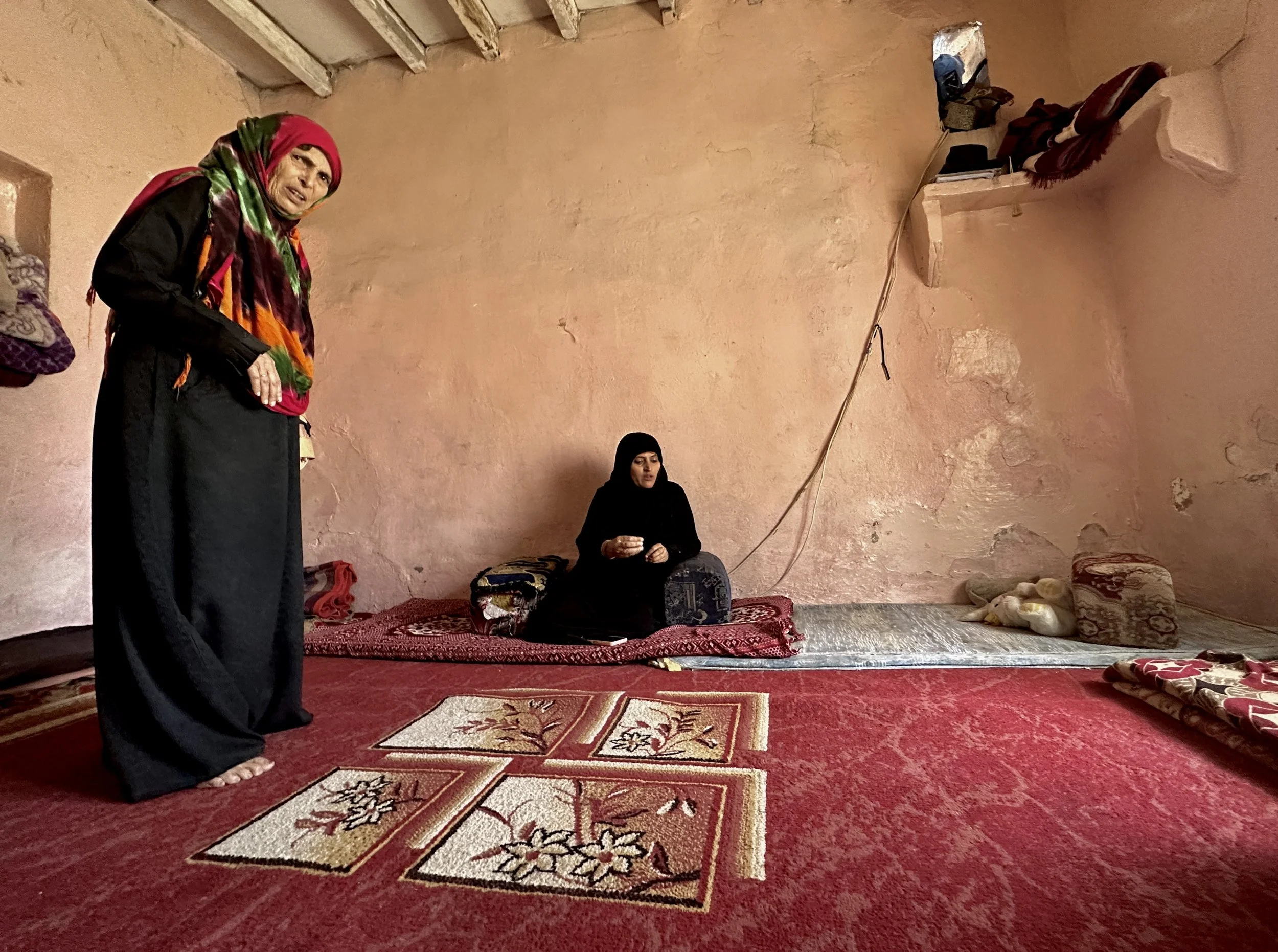 Qoboul Ahmed Al-Hajj, 70, stands beside her daughter Dalila Abdo Ahmed inside her apartment in Taiz. Qoboul travelled from the Al-Shakhab area of Saber Al-Mawadim District to visit her daughter and refused to abandon her despite the stigma often face